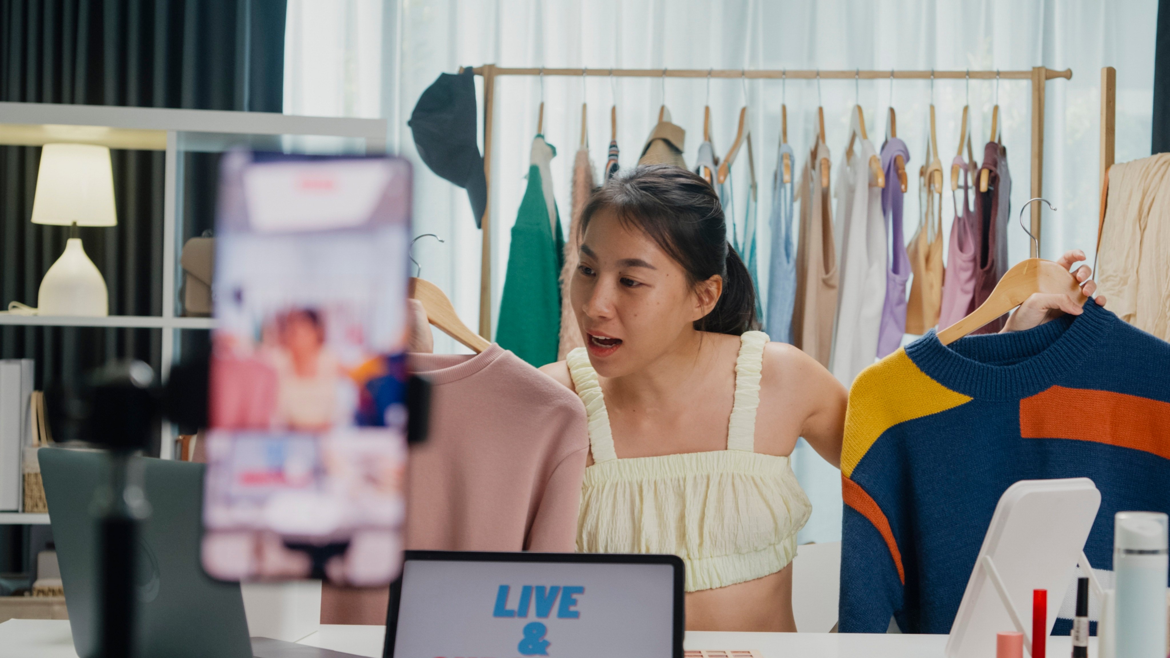 Selling second-hand clothes on TikTok, speculating on Pokemon cards and setting up home cafes are among the side hustles Singaporeans are turning to as a safety net. Photo: Shutterstock