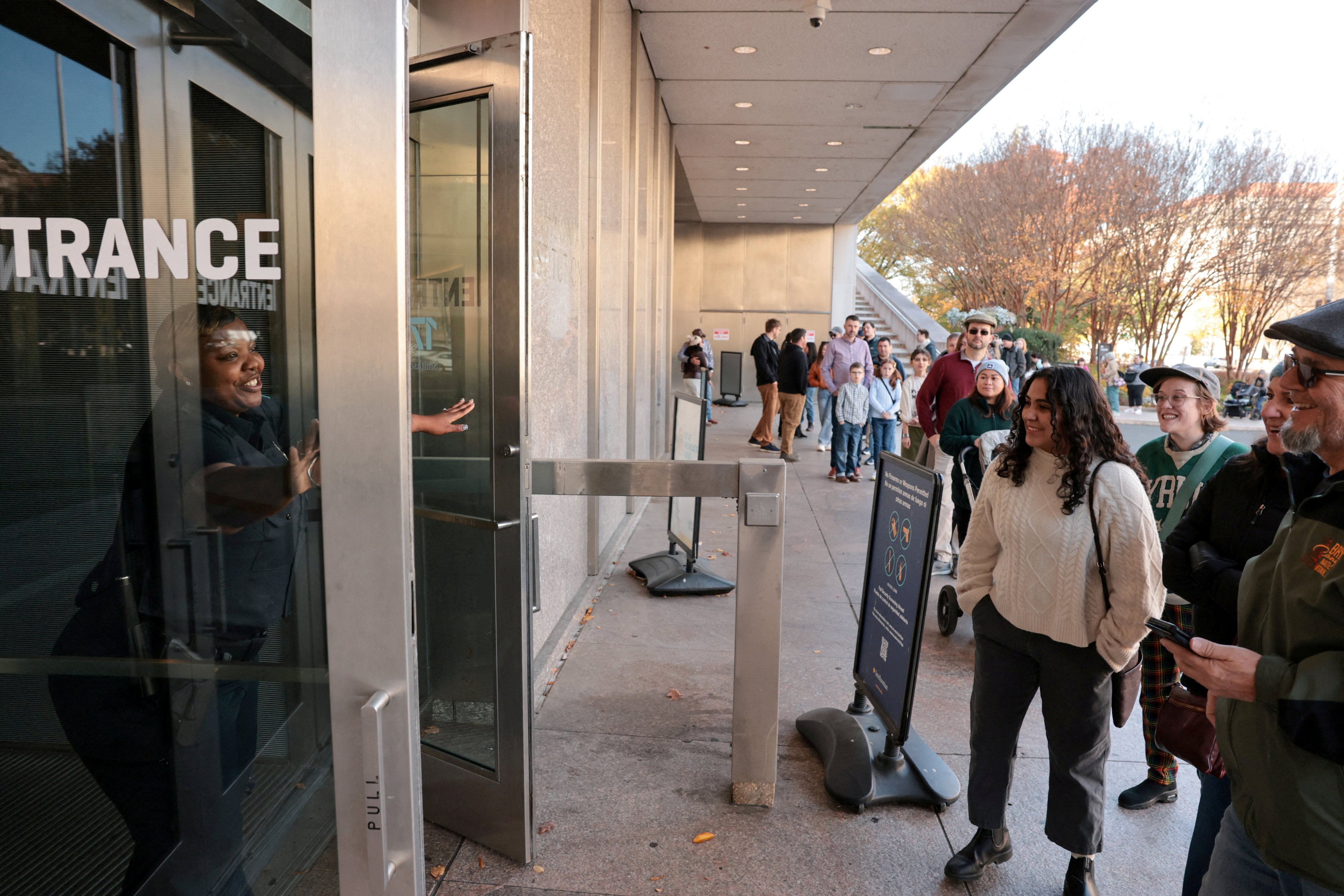 A guard welcomes visitors to the Smithsonian’s National Museum of American History in Washington last year. Photo: Reuters
