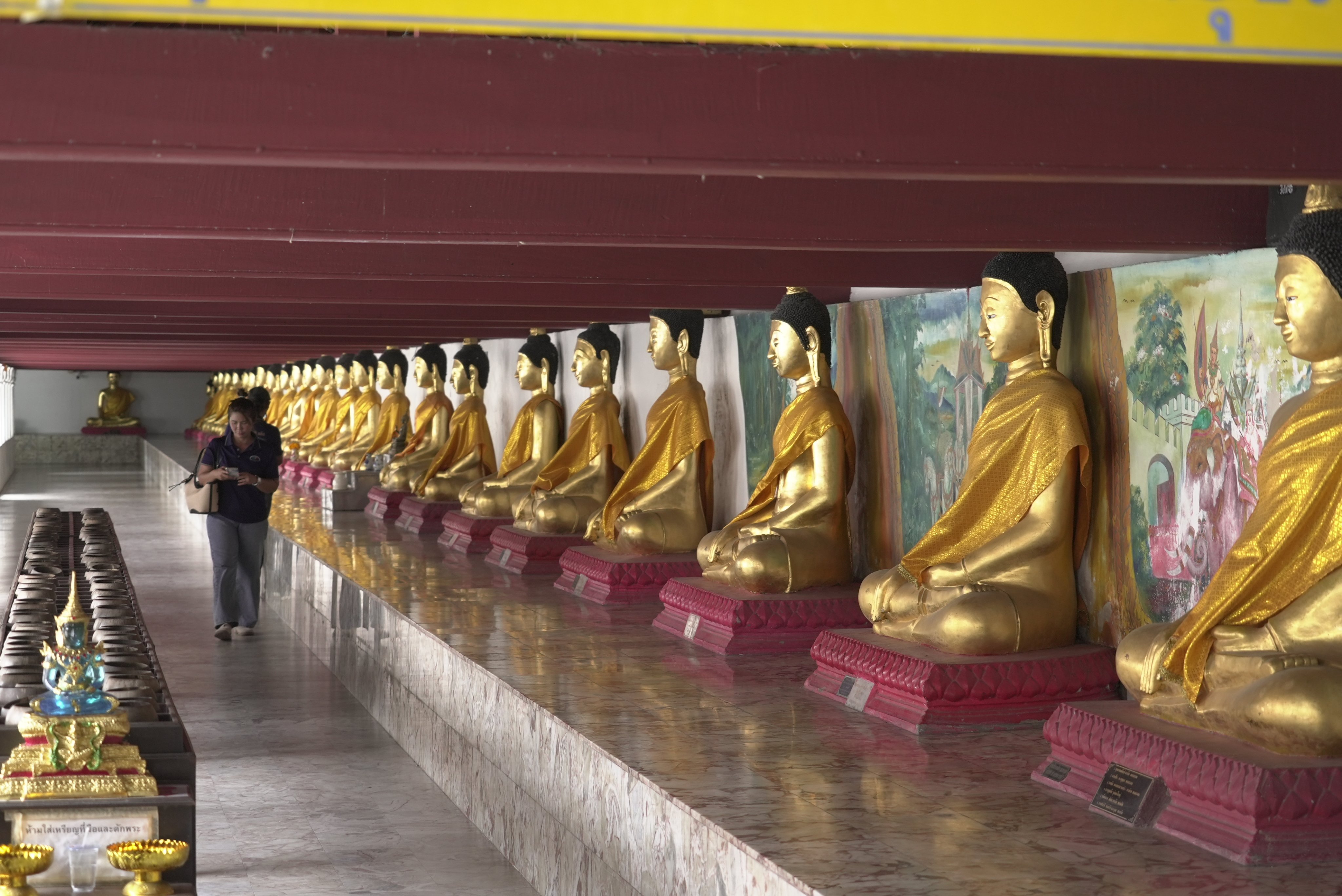 Visitors walks inside Wat Phra Mahathat Woramahawihan, a 13th-century Buddhist temple in Nakhon Si Thammarat city, Thailand, on July 3. Photo: AP