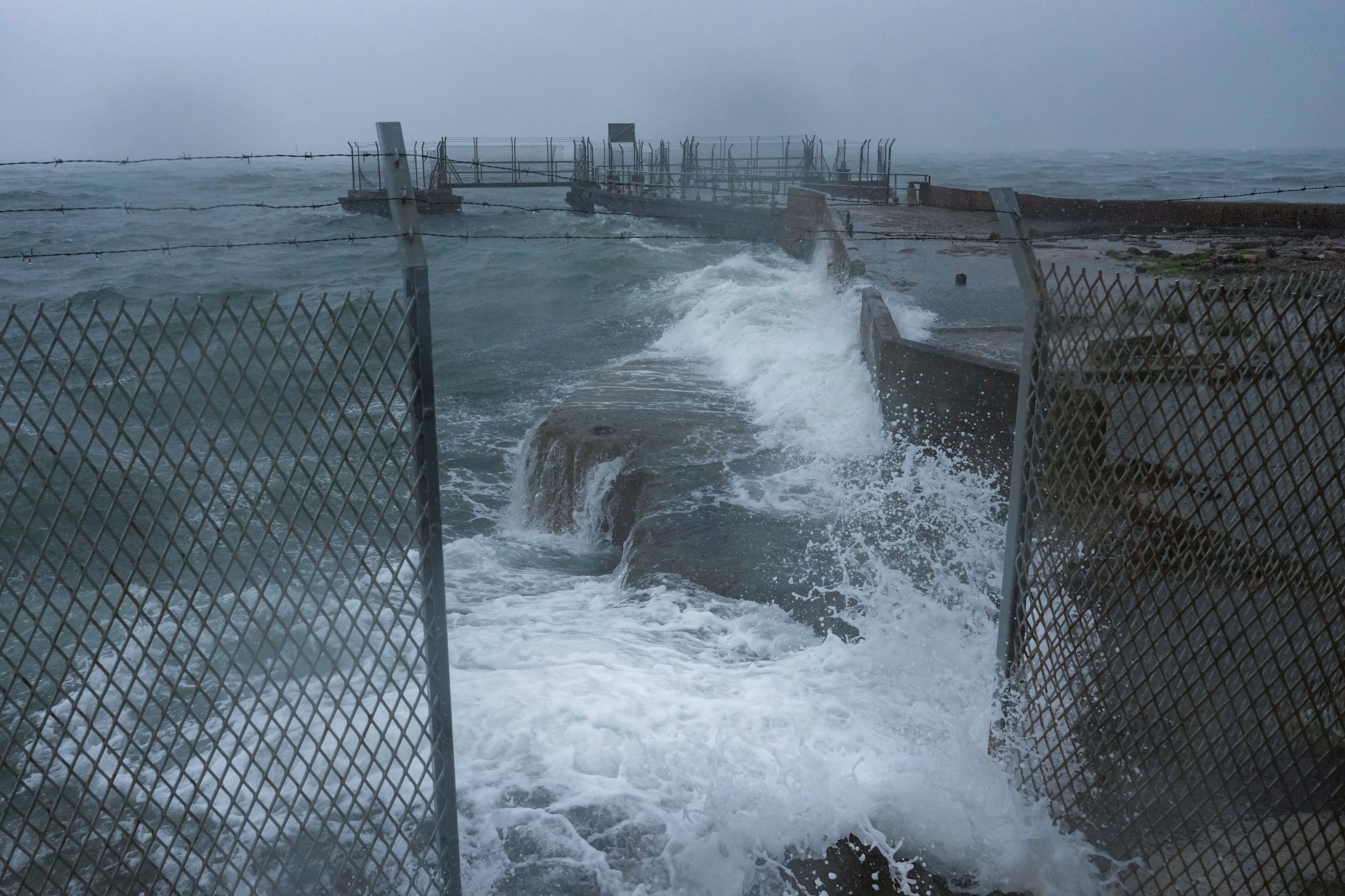 Waves hit a jetty in Kennedy Town during Typhoon Noul on Sunday. Photo: Karma Lo