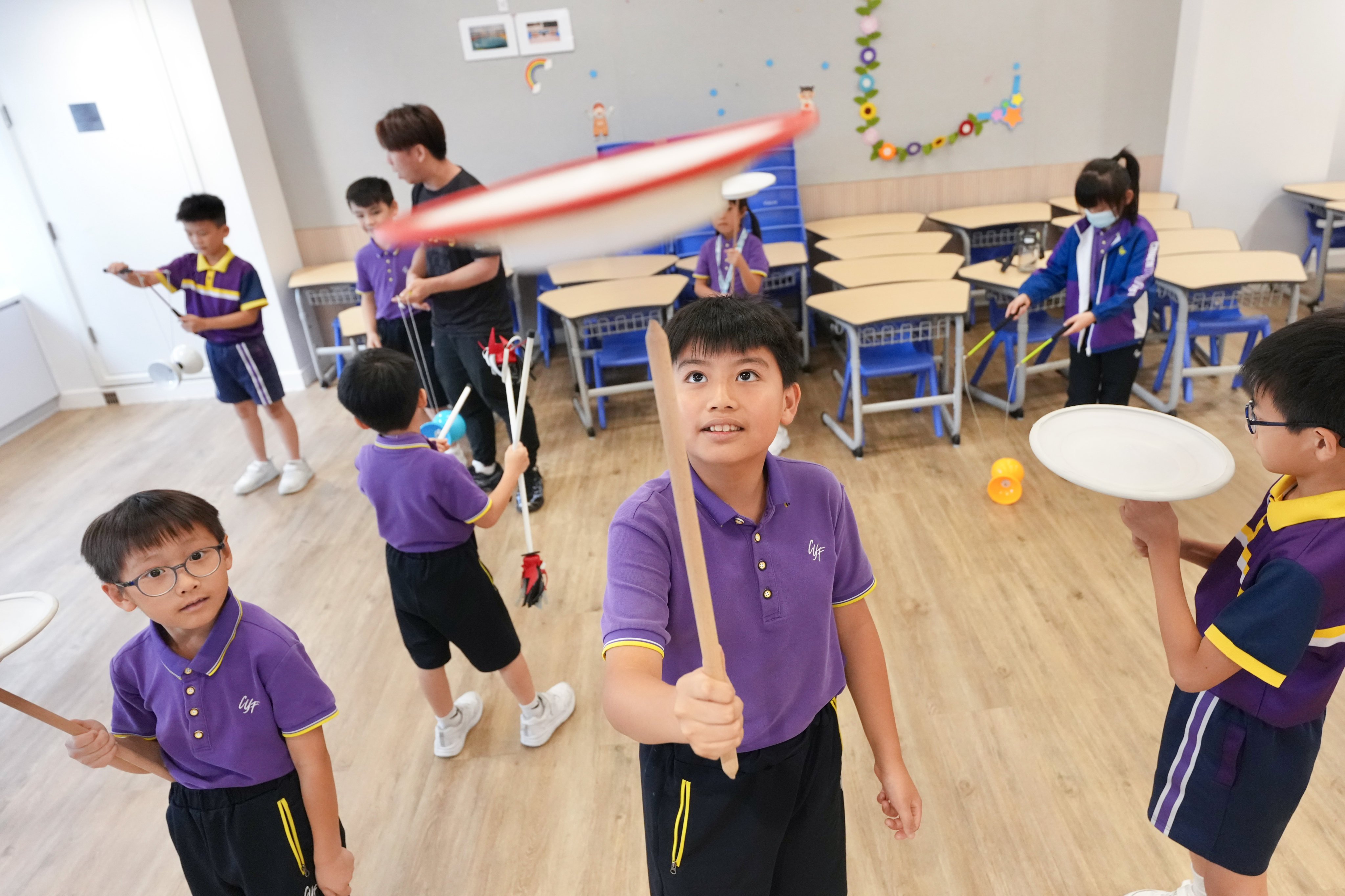 Kayden Kwok (centre) takes part in after-school activities at CCC Chuen Yuen First Primary School in Tsuen Wan. Photo: Karma Lo