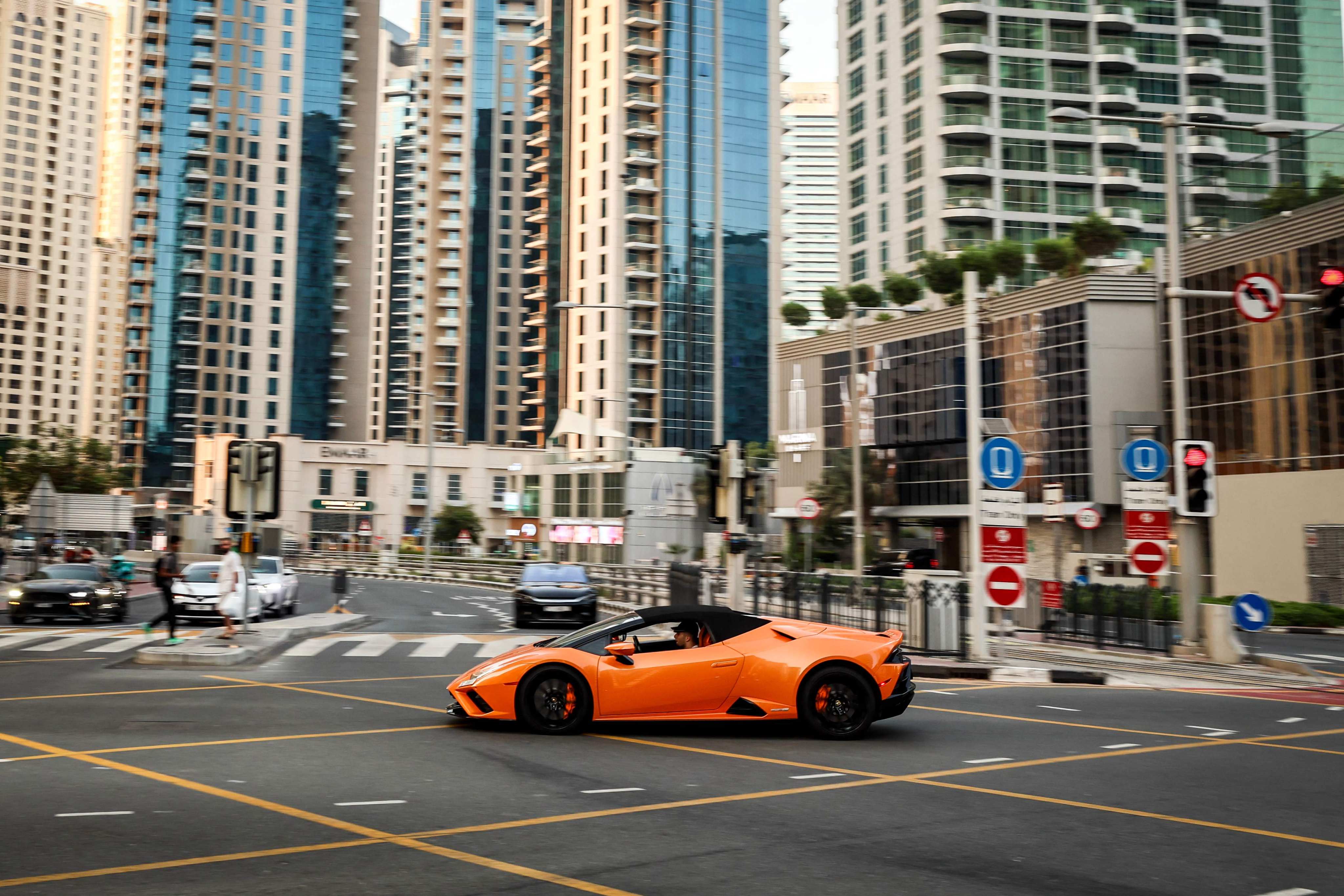 A luxury sports car is driven through Dubai’s Marina district on Tuesday. Photo: AFP