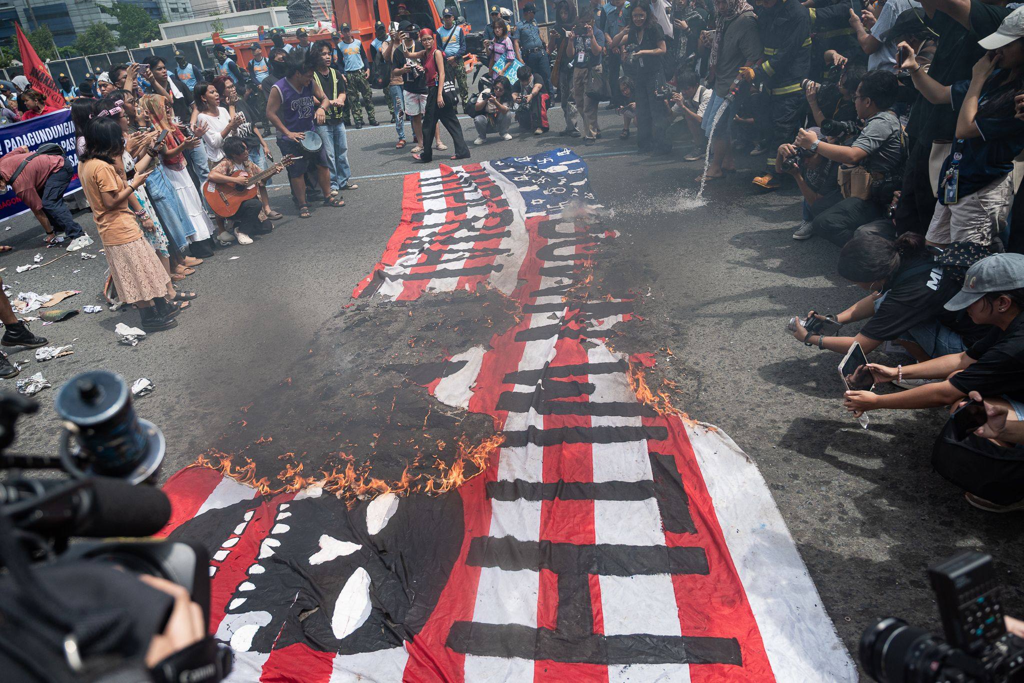 Protesters march along Commonwealth Avenue, ahead of President Ferdinand Marcos Jnr’s fifth State of the Nation Address on Monday. Photo: dpa