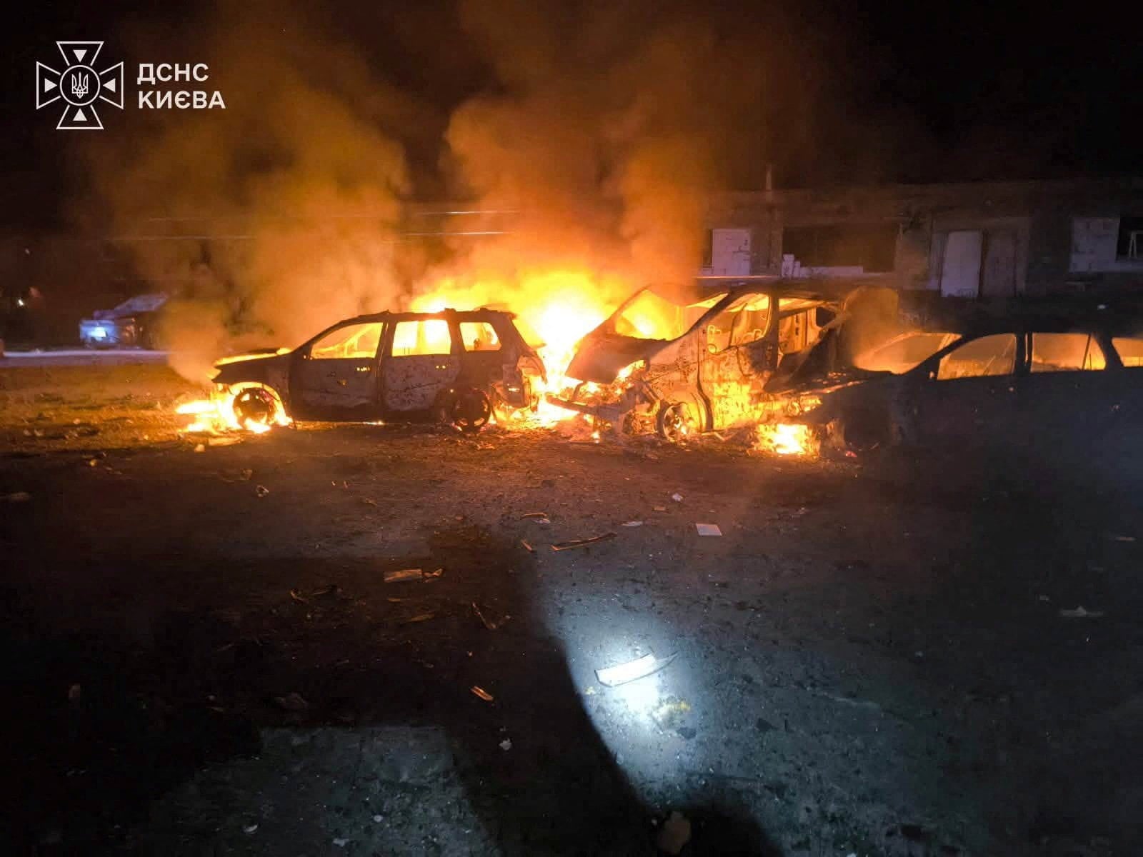 Smoke and fire rise from burning vehicles at the site of a Russian strike in a location given as Kyiv, Ukraine on Sunday. Photo: State Emergency Service of Ukraine in Kyiv Region / Handout via Reuters