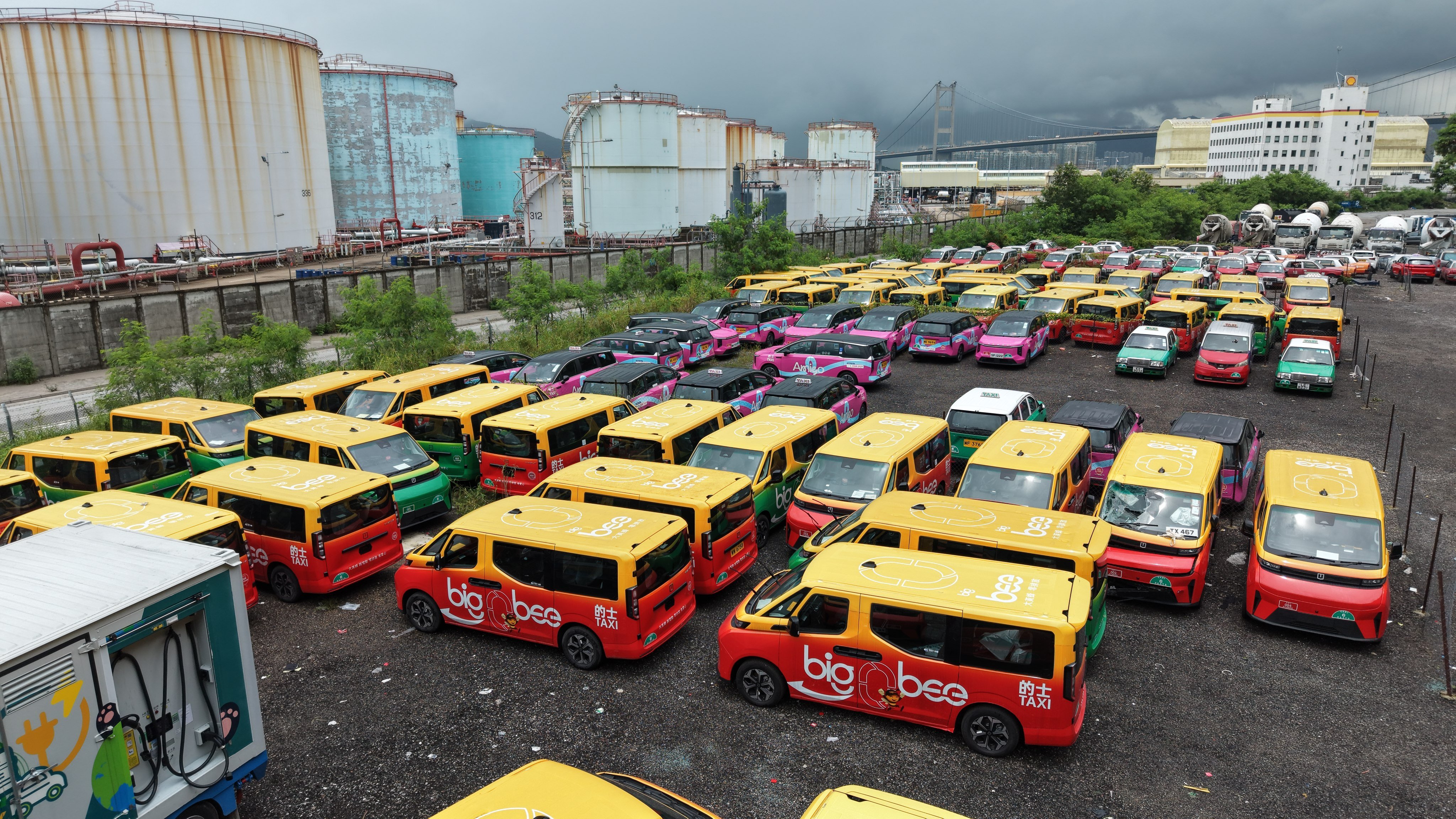 Premium taxis in an outdoor car park in Tsing Yi. More than 2,000 fleet taxis and about 2,400 drivers are currently in service. Photo: Sam Tsang