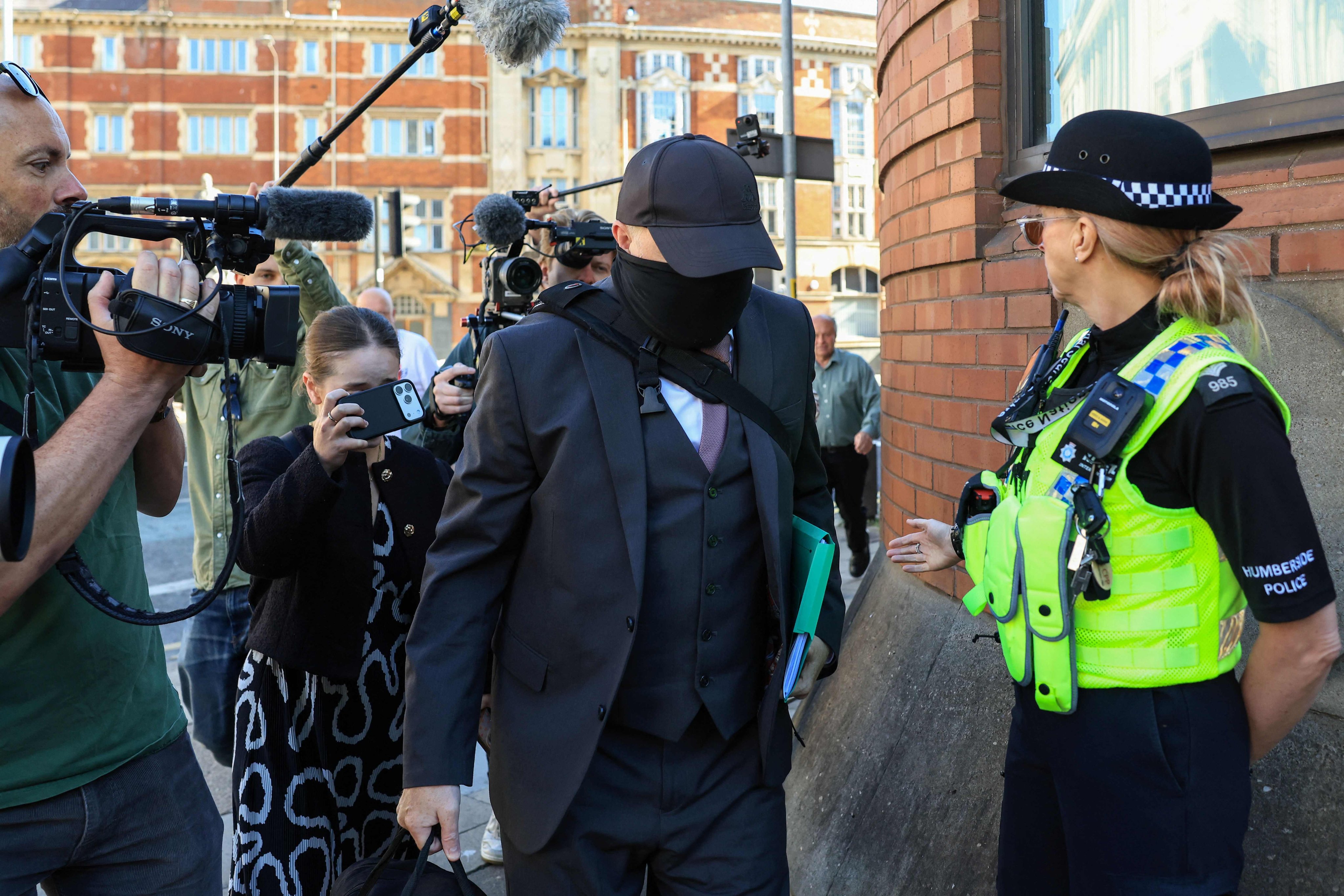 Robert Bush, a funeral director guilty of defrauding and deceiving grieving families, arrives ahead of his sentencing outside the Hull Crown Court in Kingston upon Hull on Monday. Photo: AFP