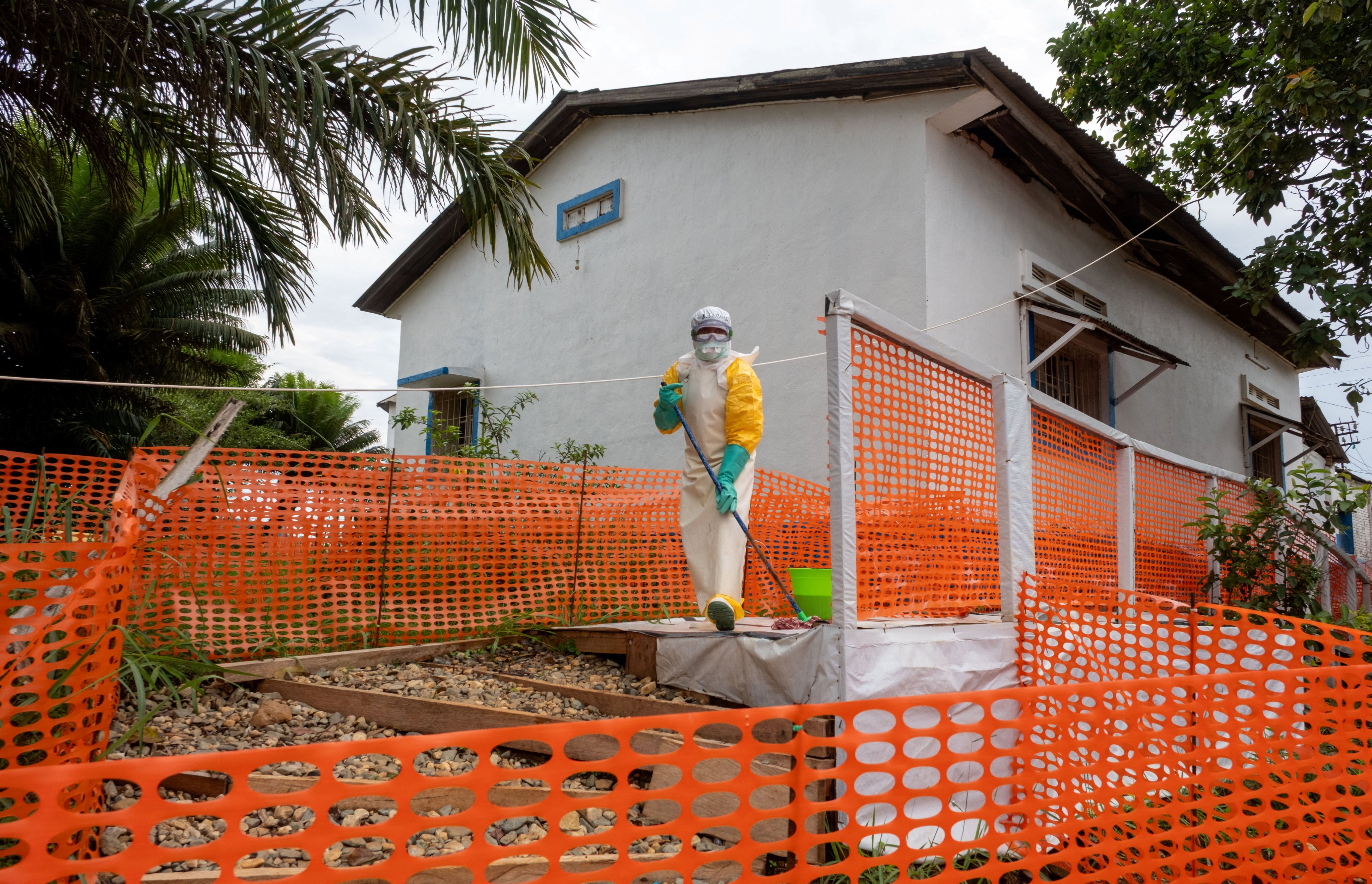 A Congolese health worker cleans outside her station at the Mongbwalu General Hospital in the Ebola-stricken town of Mongbwalu in the Democratic Republic of Congo on July 24. Photo: Reuters