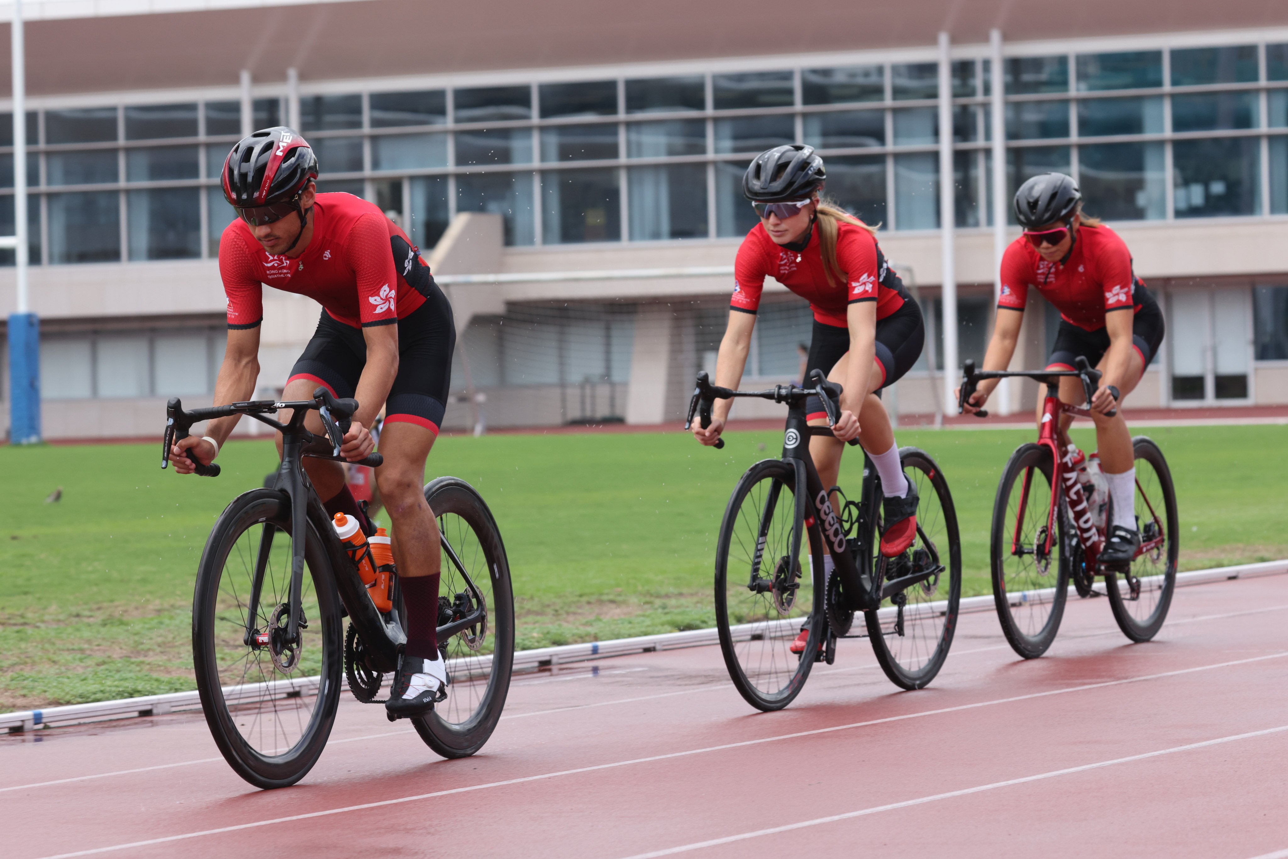 Hong Kong triathletes (from left) Jason Ng Tai-long, Bailee Brown and Hilda Choi Yan-yin train at the Hong Kong Sports Institute on August 21, 2023. Photo: Yik Yeung-man