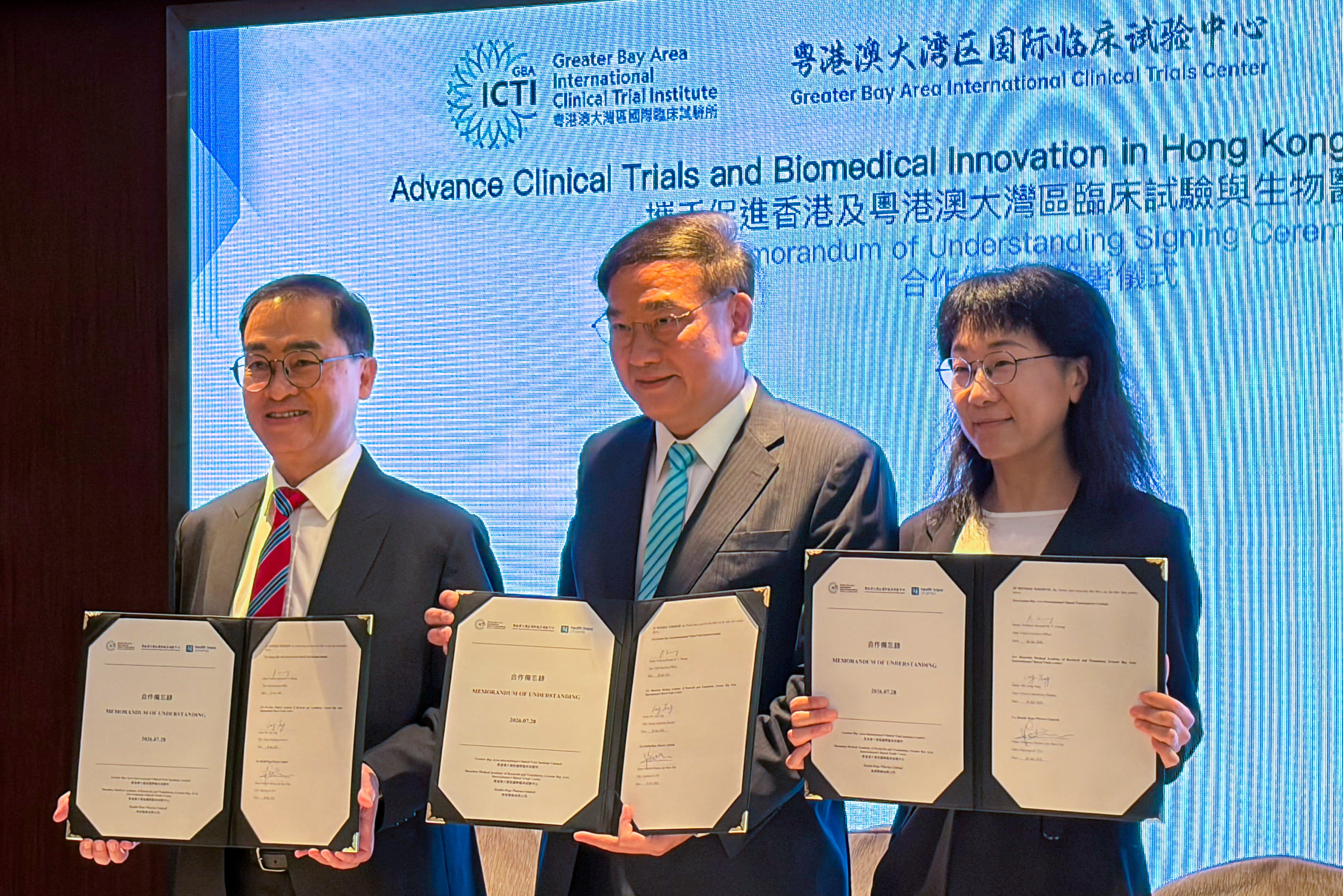 (From left) The GBAICTI's Bernard Cheung, Health Hope Pharma's Dennis Lam and Ling Tang from the Shenzhen clinical trials centre display the memorandum of understanding. Photo: Emily Hung