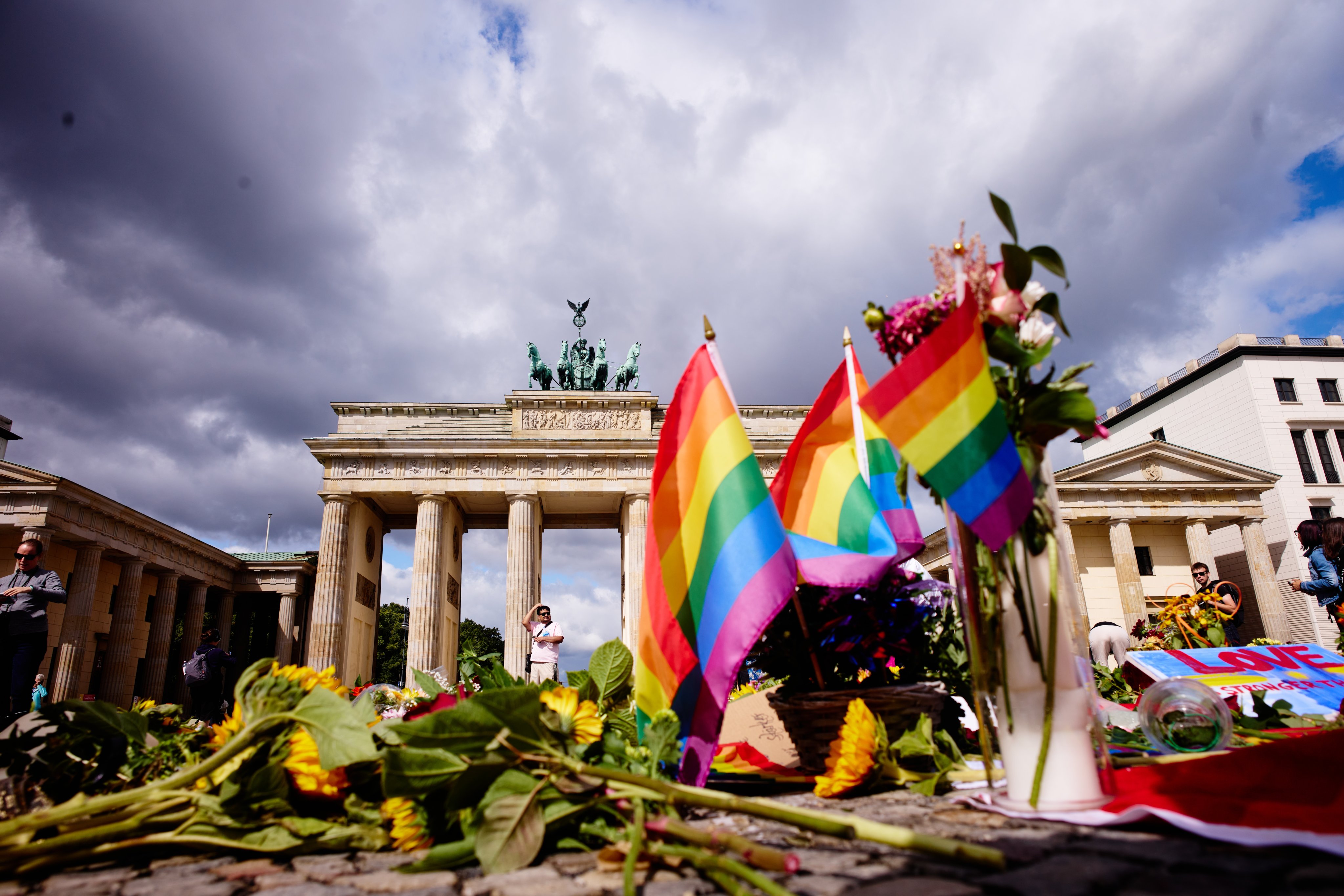 Flowers and rainbow flags in front of the Brandenburg Gate commemorating the victims of a car attack on Berlin’s Pride event. On Monday, the UK said armed officers would be deployed at this weekend’s Brighton and Hove Pride. Photo: AP