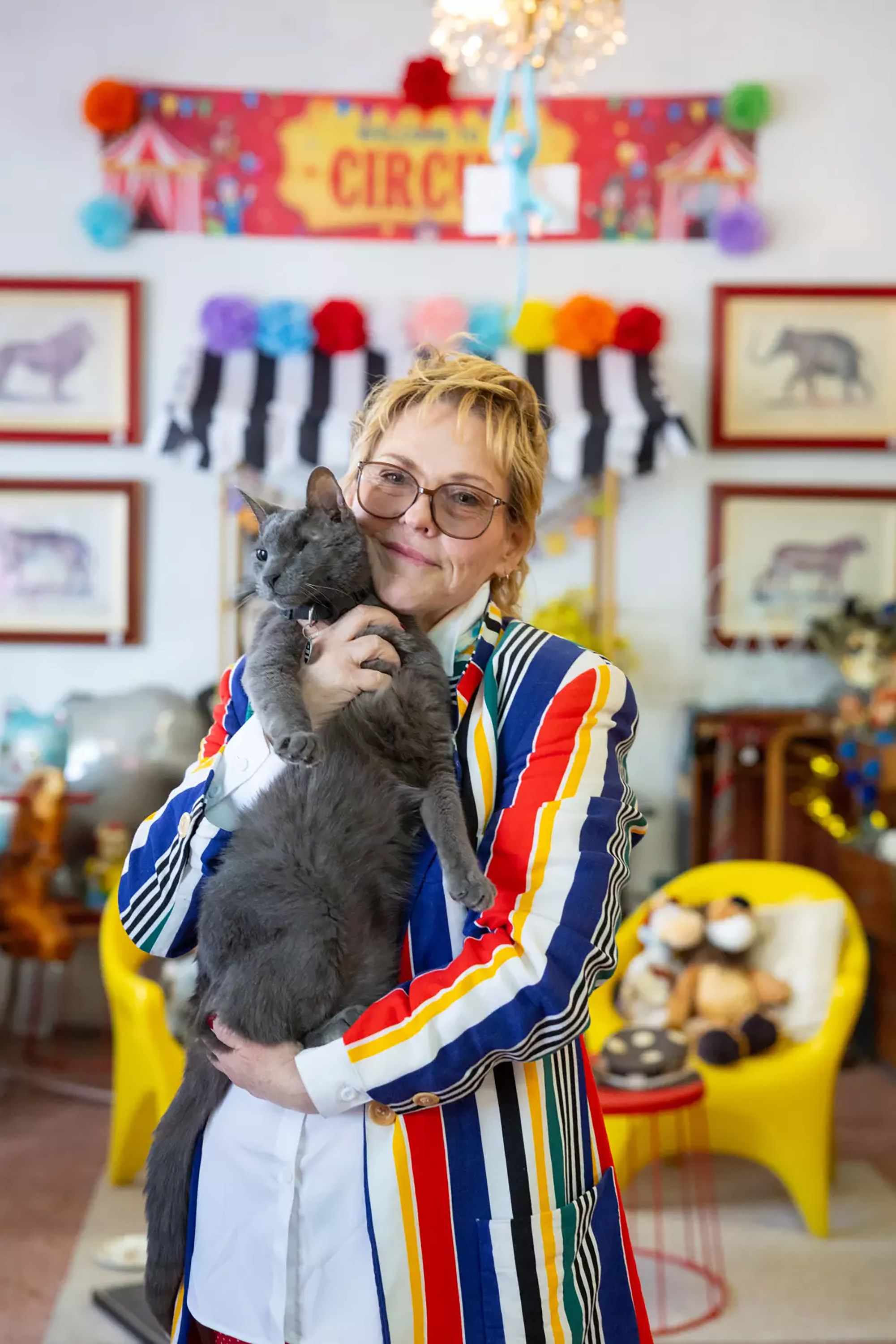 Elizabeth Kobliha holds her cat Likho. When she opened her vintage store, she knew she wanted a shop cat. Photo: Los Angeles Times/TNS