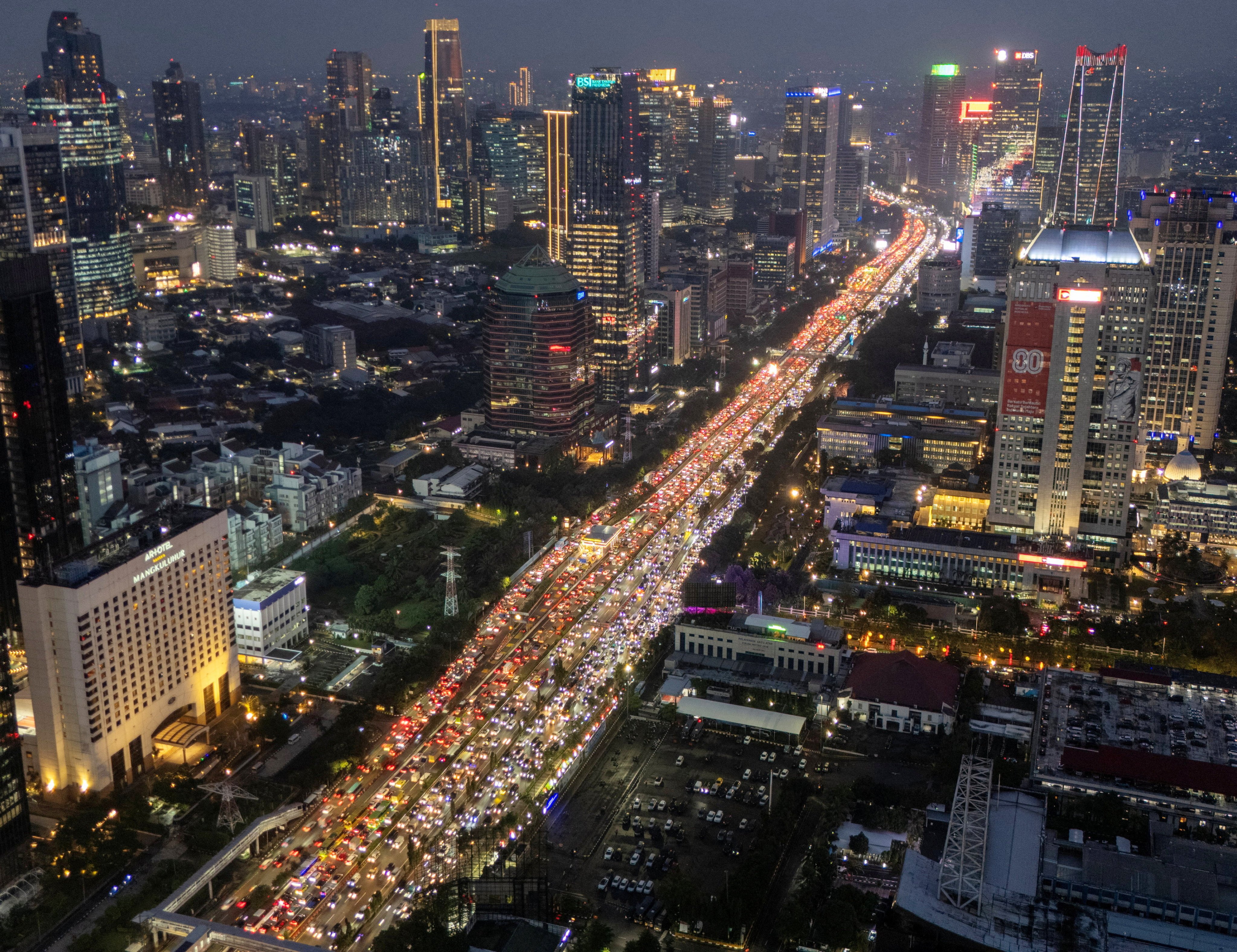 A drone view shows traffic during evening rush hours at the business district in Jakarta, Indonesia. Mainland Chinese firms are expanding into Asean markets. Photo: Reuters
