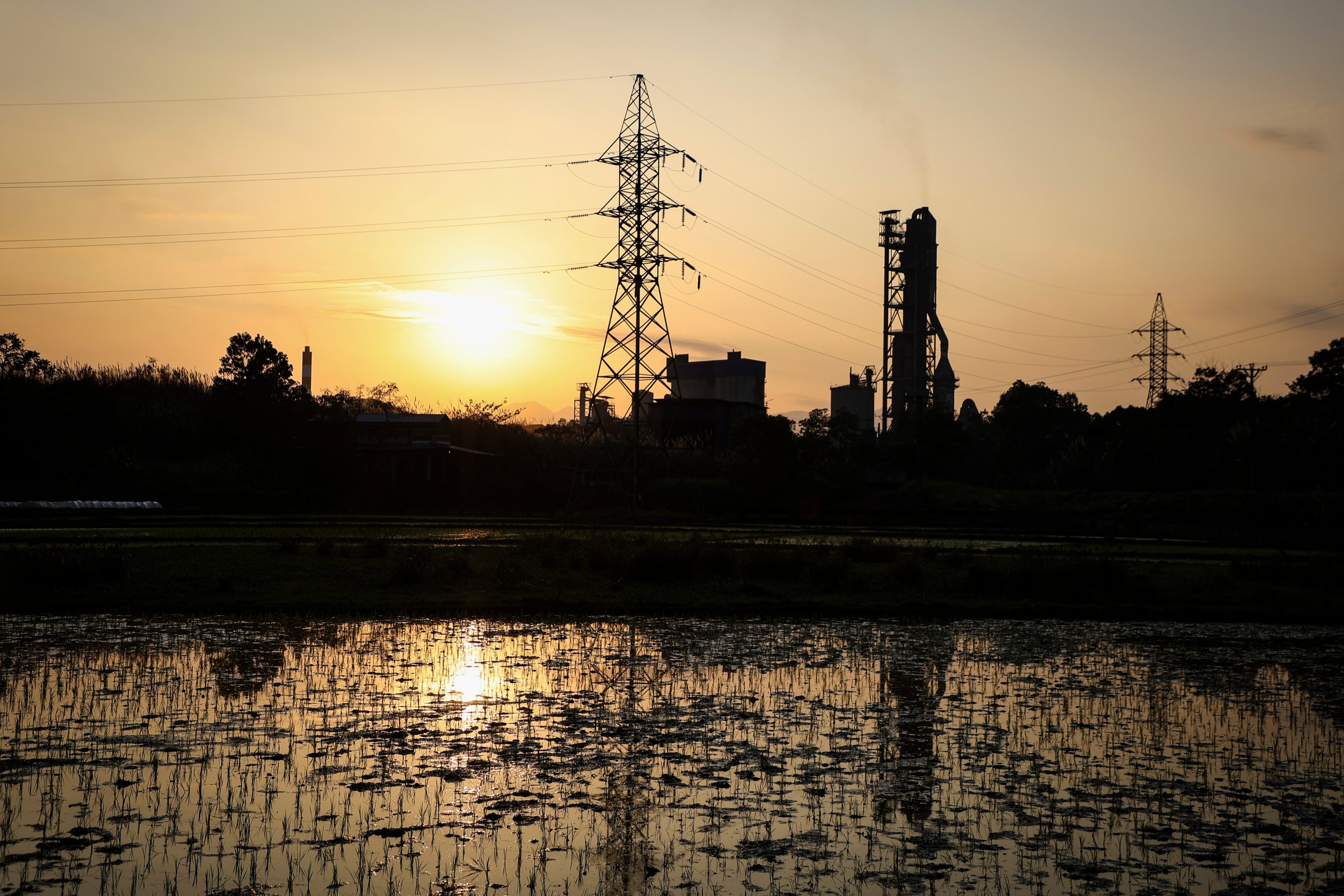 A power plant and transmission lines in Thai Nguyen province, Vietnam. The International Development Finance Corporation has reportedly held talks with Vietnam on grid modernisation. Photo: AP