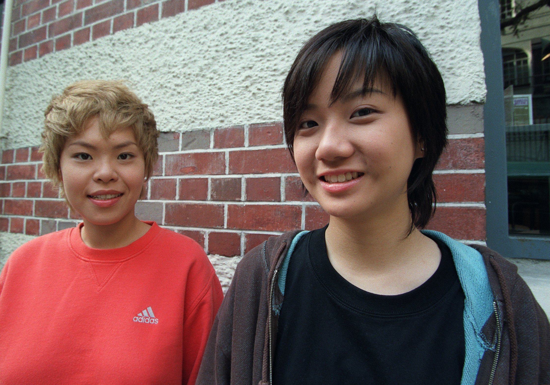 Ellen Loo (right) and her at17 bandmate Eman Lam outside the Fringe Club in Central in 2002. Photo: SCMP