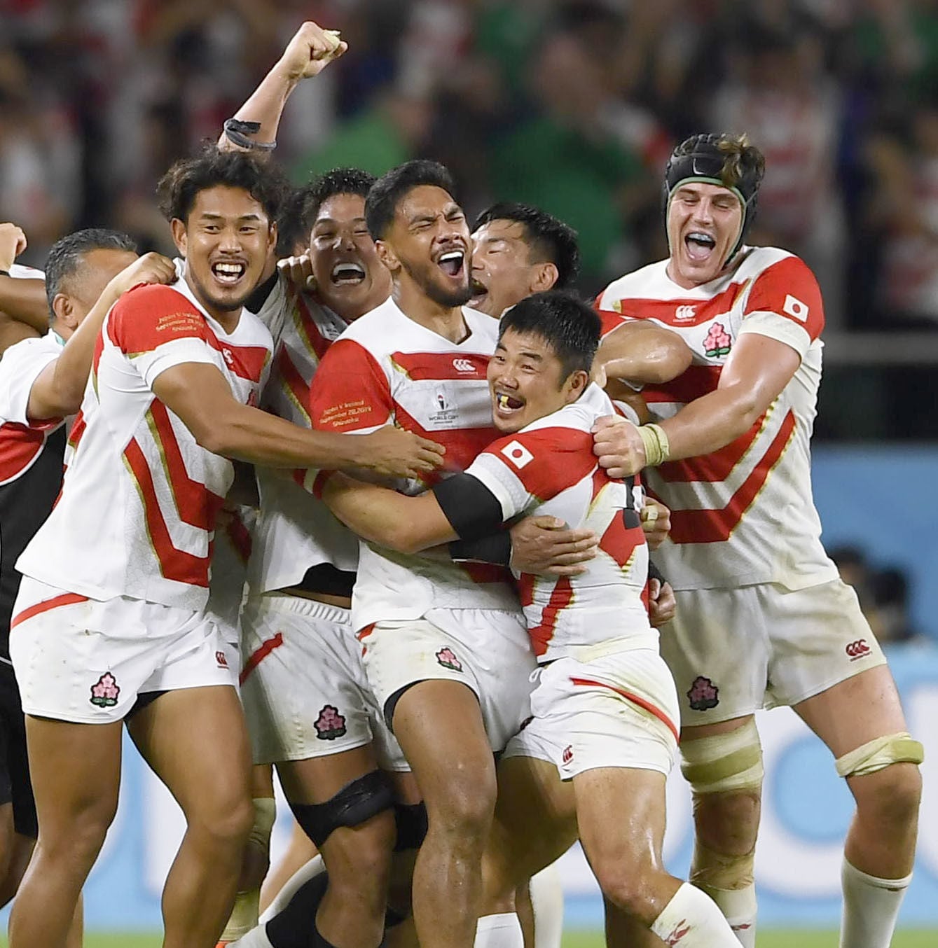 Timothy Lafaele (centre) and Japan teammates celebrating their 2019 Rugby World Cup pool-stage win over Ireland in Fukuroi, Shizuoka Prefecture. Photo: Kyodo