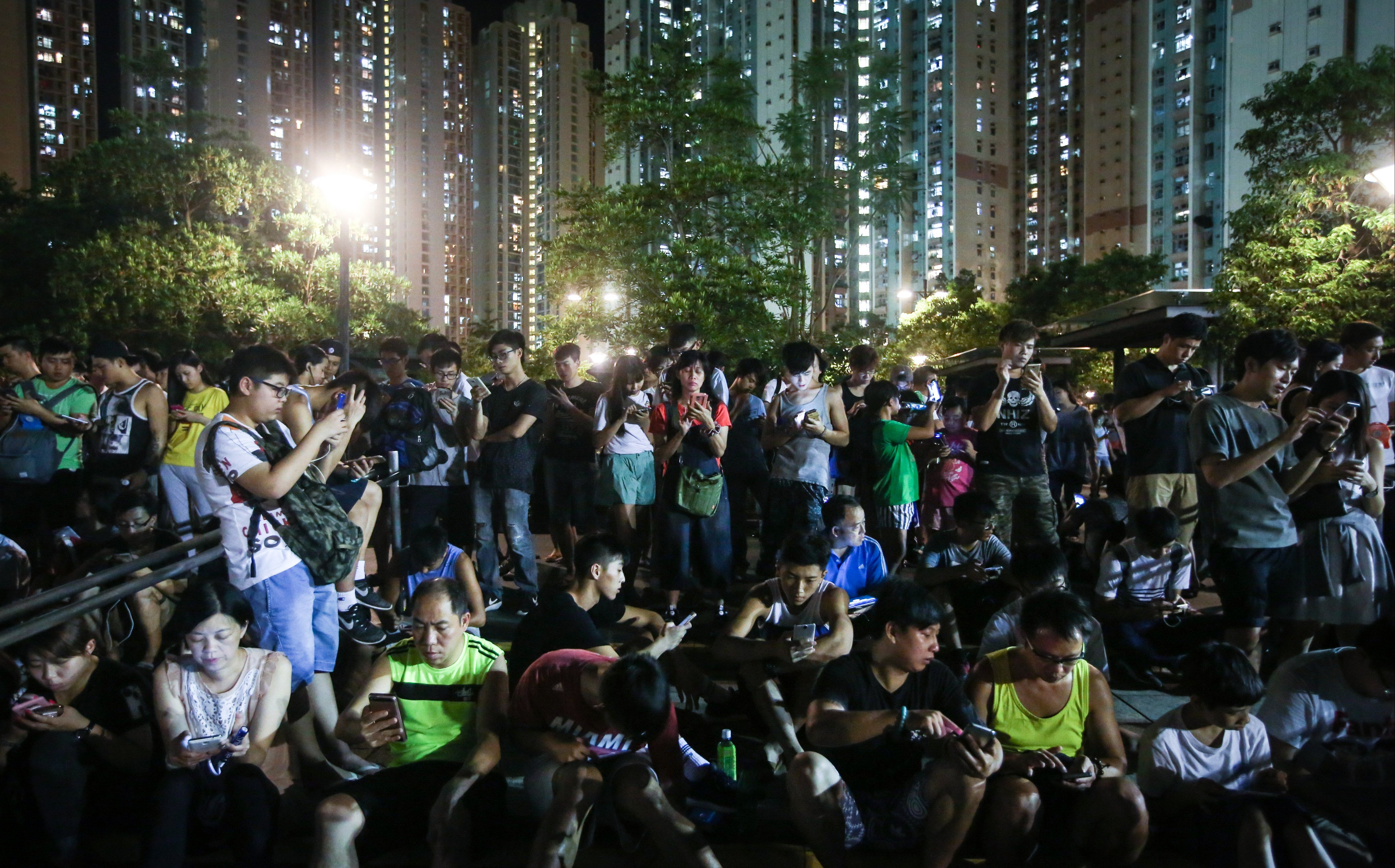 People gather to play Pokemon Go in Tin Shui Wai on July 28, 2016. Photo: Sam Tsang