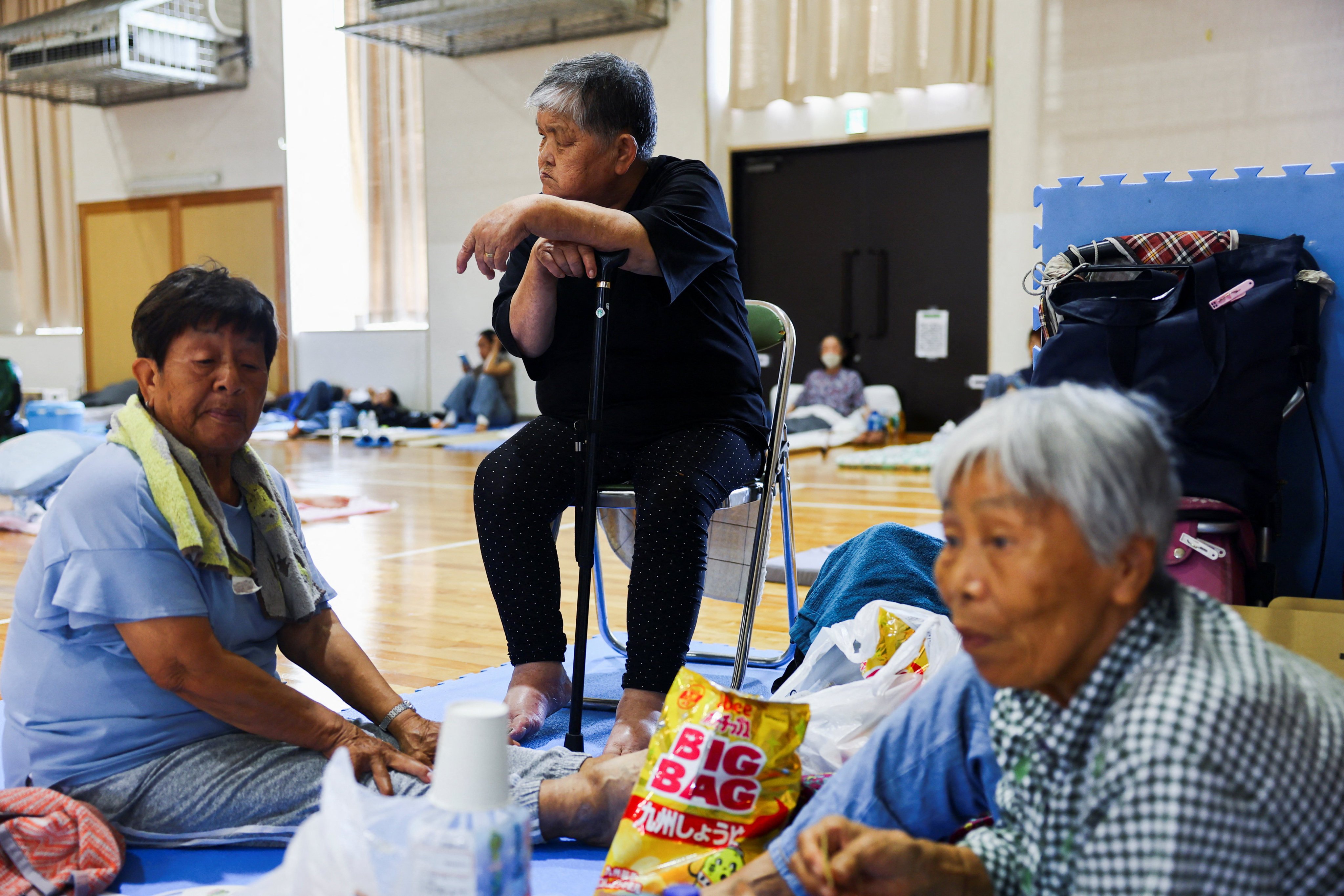 Local residents rest inside a gymnasium at a community centre, which is serving as an evacuation shelter, in Yatsushiro on Thursday. Photo: Reuters