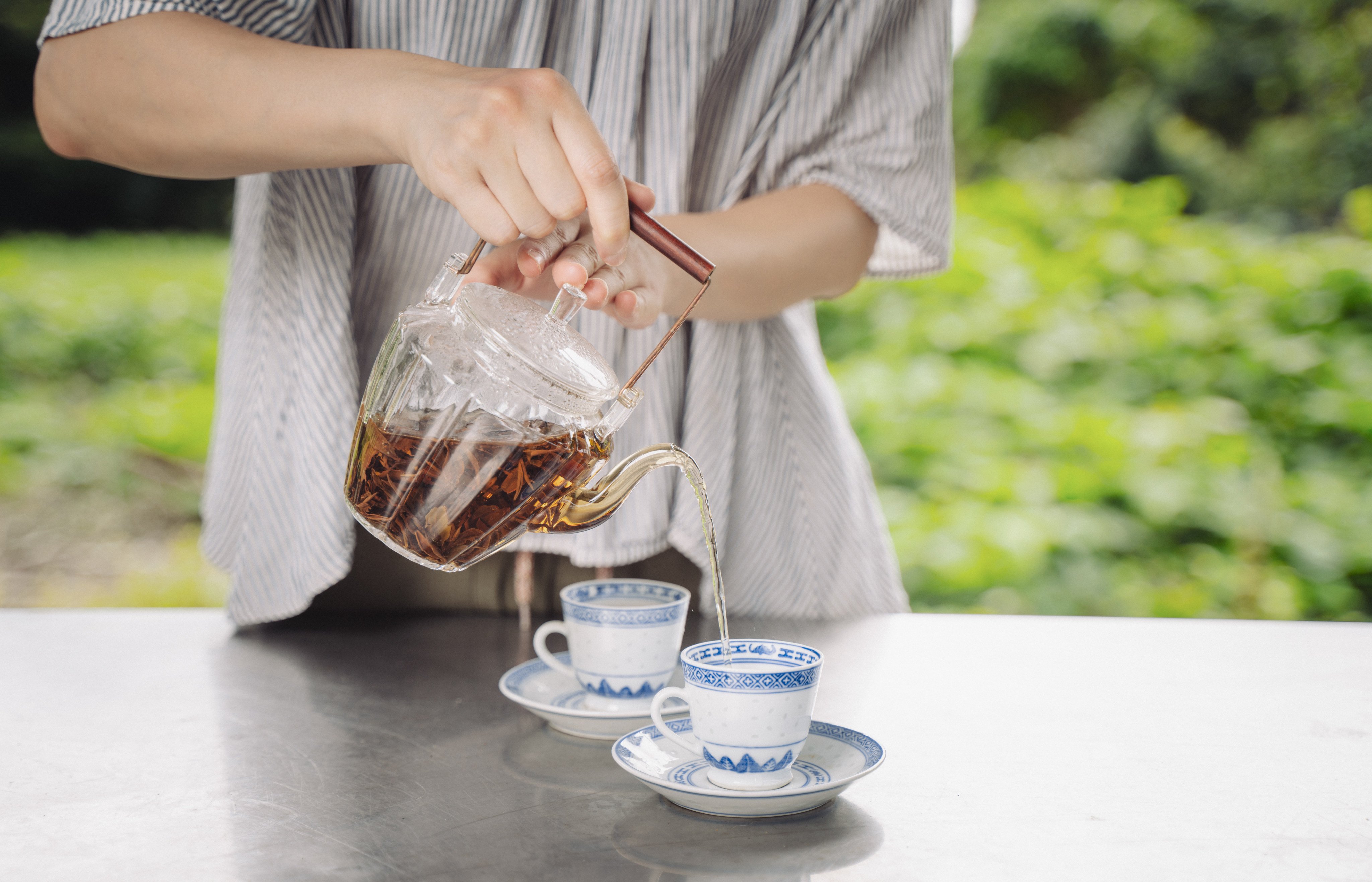 Li In, co-founder of the Hong Kong Tea Production Institute, Li pours a brew at Mau Tso Ngam village. Photo: Alexander Mak