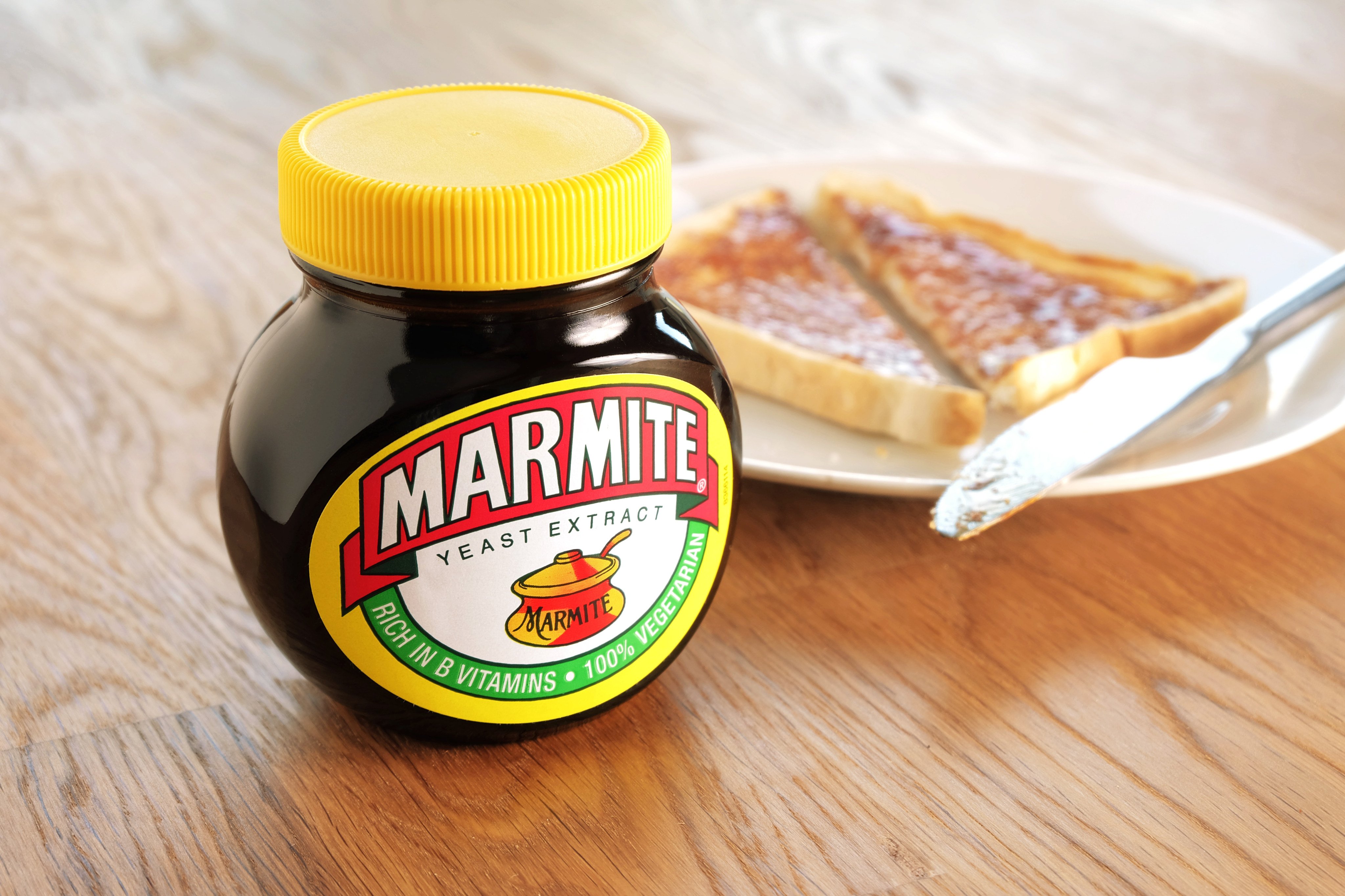 A jar of Marmite alongside one of the preferred vehicles for enjoying the divisive yeast spread: a slice of toast with butter. Photo: Shutterstock