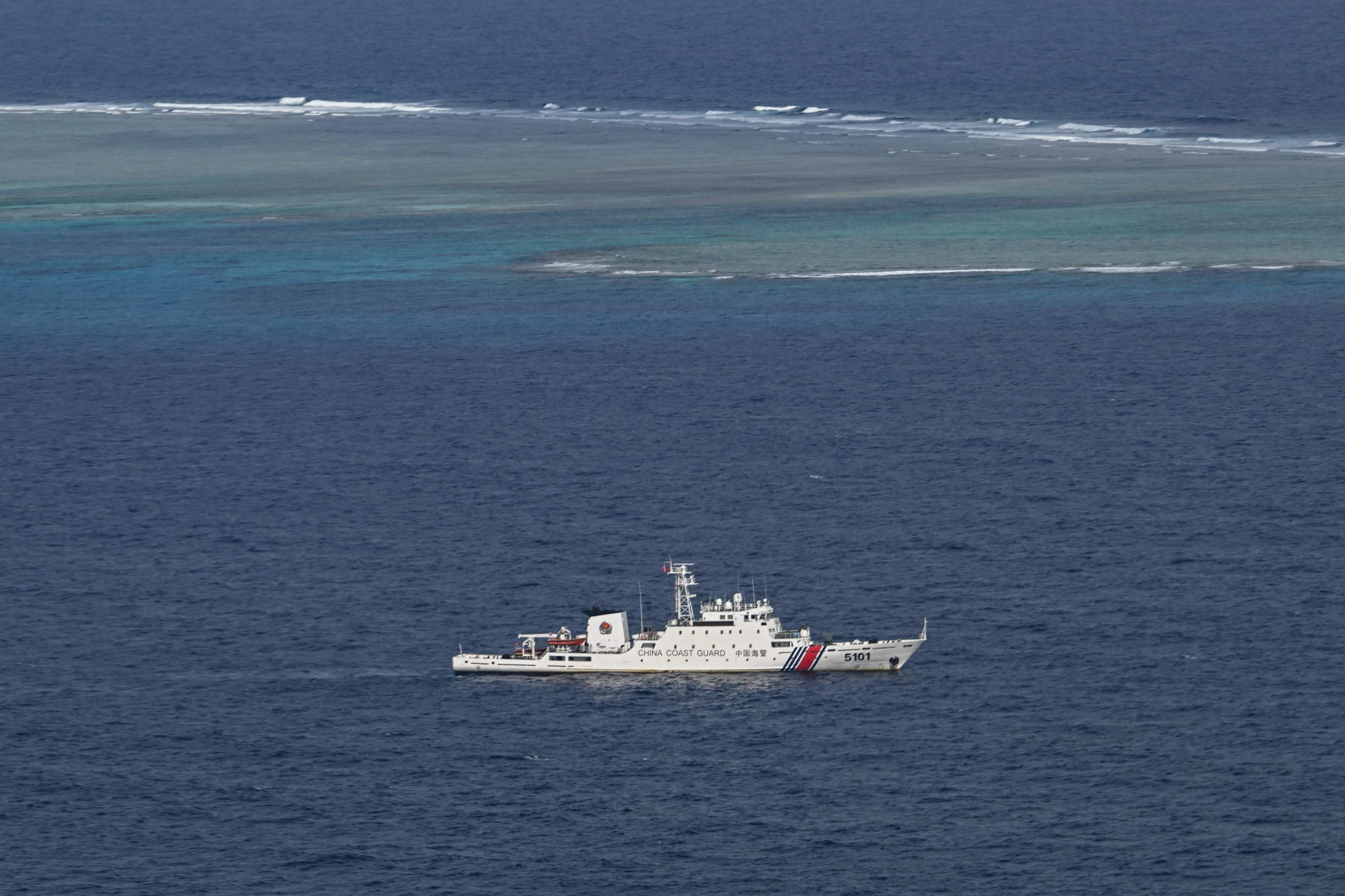 A China Coast Guard vessel sails near Thitu Island on February 21, 2026. Manila’s proposed extended continental shelf would stretch across the seabed near the Philippine-held feature, also known as Pagasa Island. Photo: AFP
