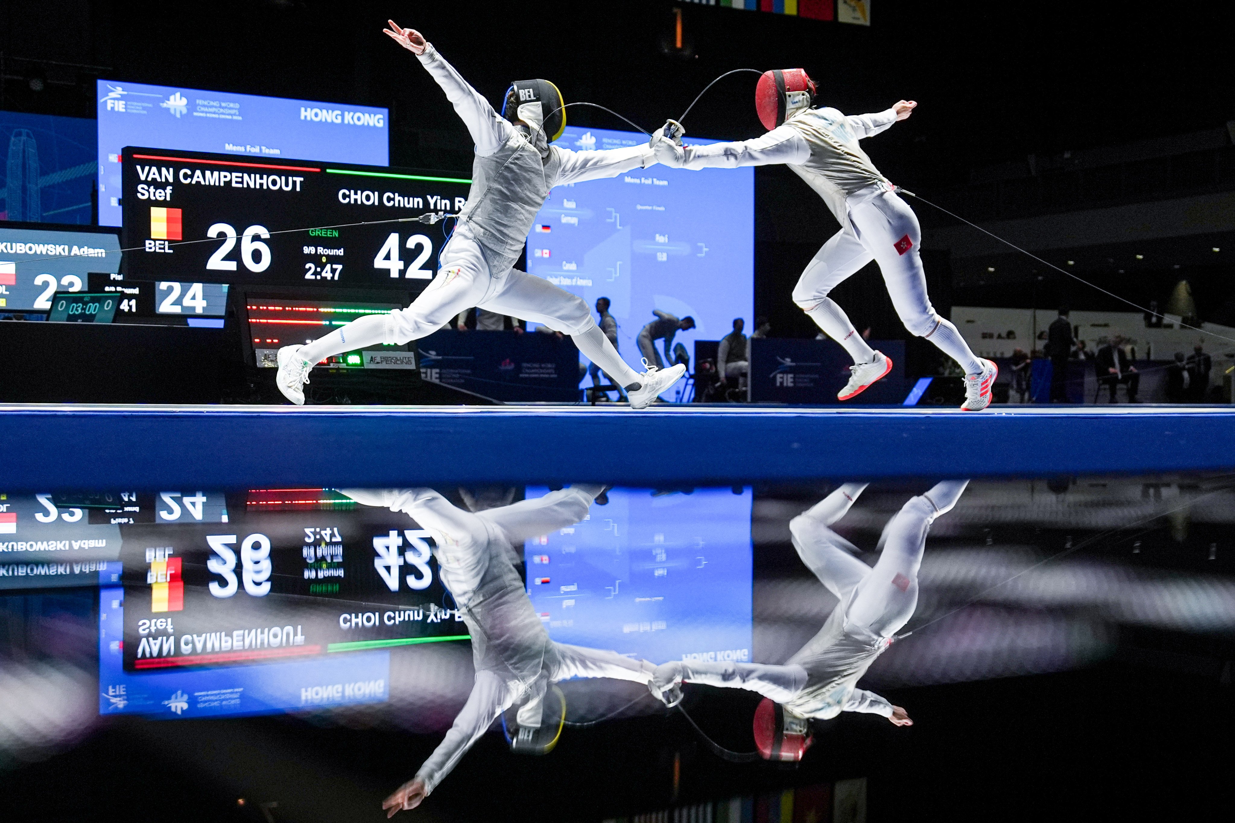Hong Kong’s Ryan Choi (right) in action against Belgium’s Stef Van Campenhout in the men's team foil round of 16 at AsiaWorld-Expo on Tuesday. Photo: Elson Li