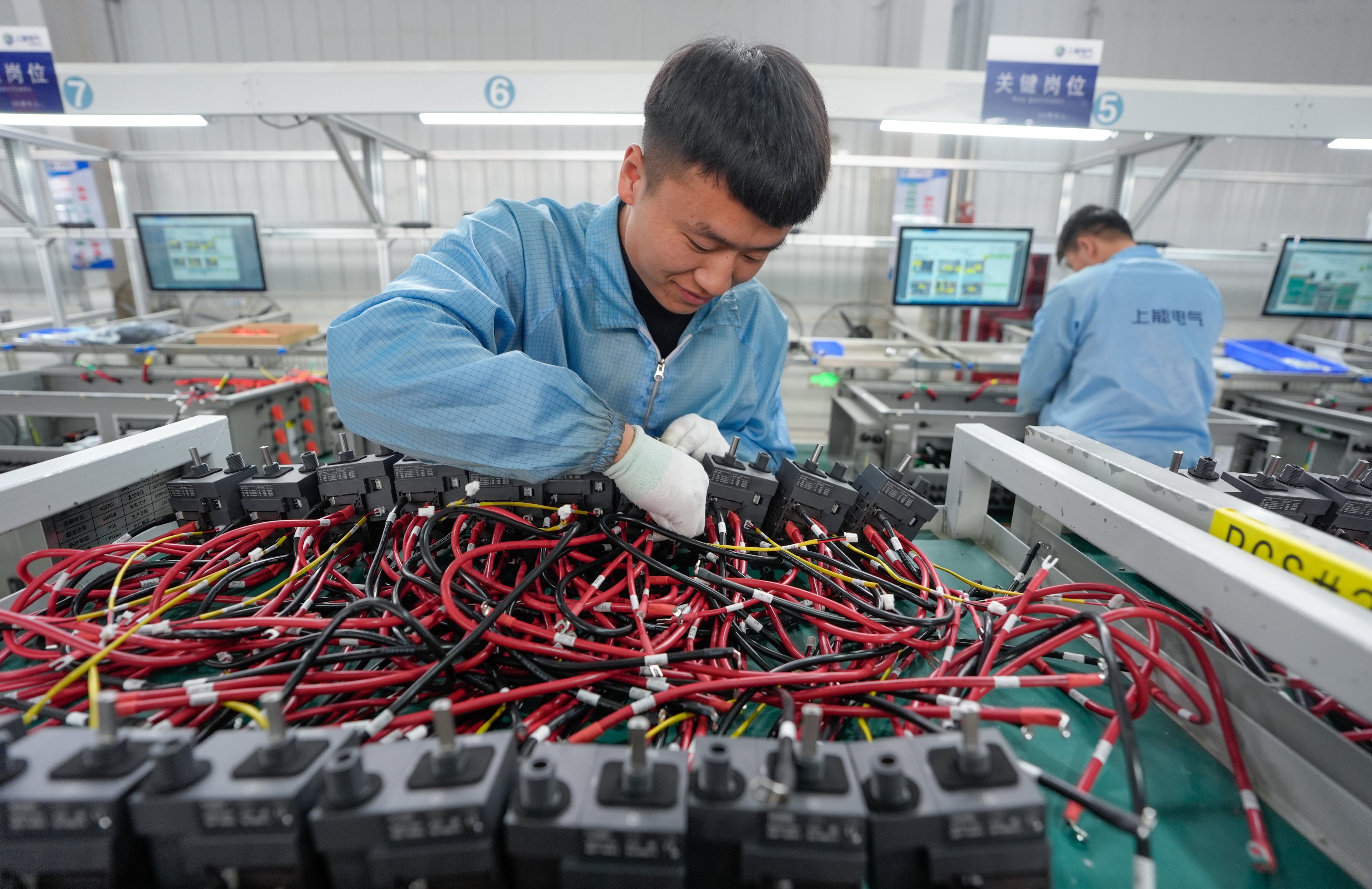 Staff members assemble inverters at an industrial park in Tongxin county in Wuzhong, northwest China’s Ningxia Hui autonomous region, on February 20, 2025. Photo: Xinhua