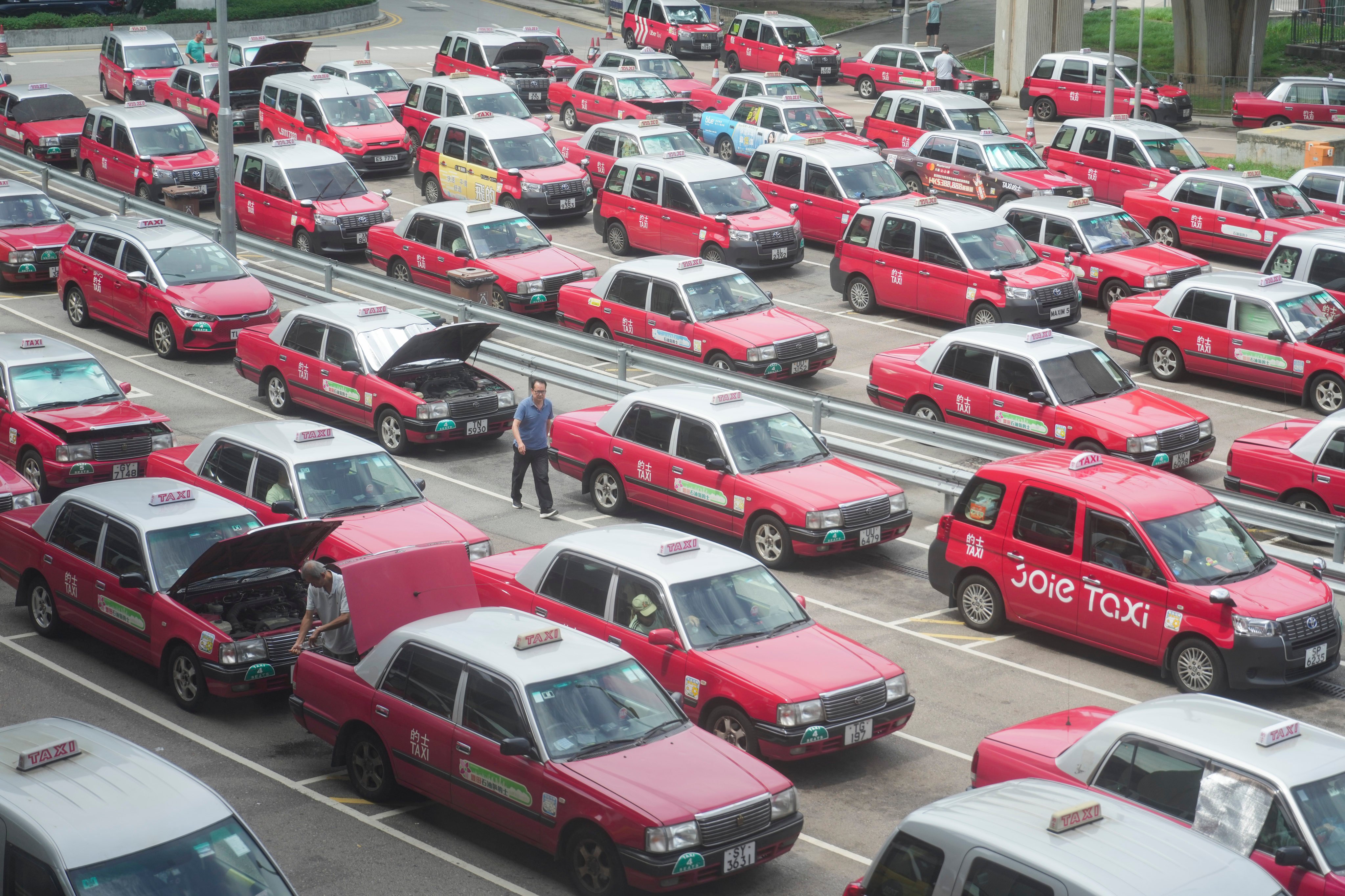 Regular and premium taxis queue at Hong Kong International Airport on July 15. Photo: Sam Tsang