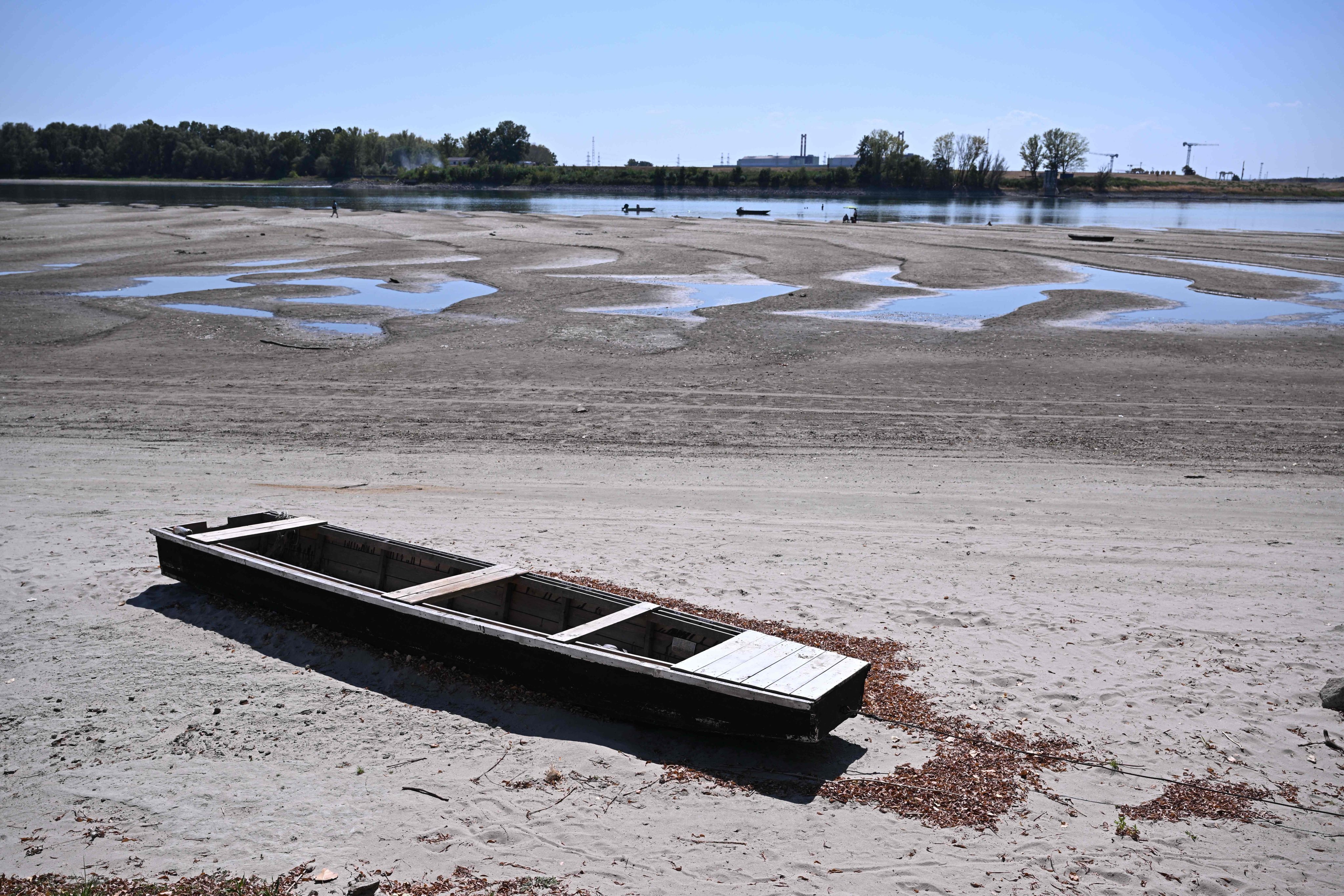 The dried-up Danube riverbed is pictured on Friday with Hungary’s Paks power plant in the background. Photo: AFP