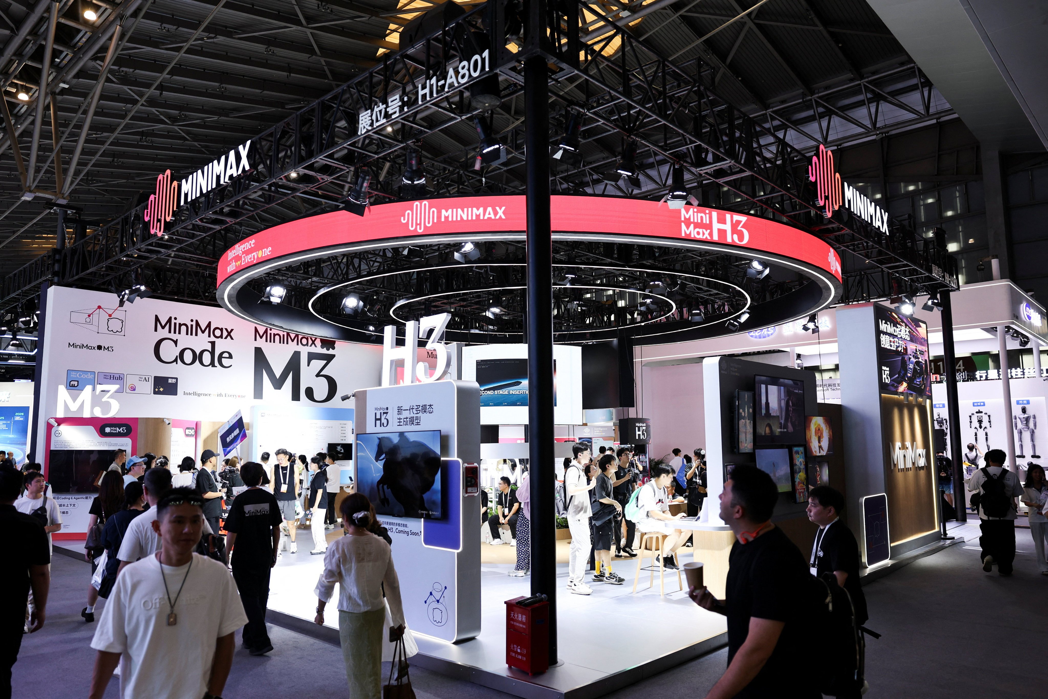 People walk past the MiniMax booth during the World Artificial Intelligence Conference in Shanghai on July 17. Photo: Reuters