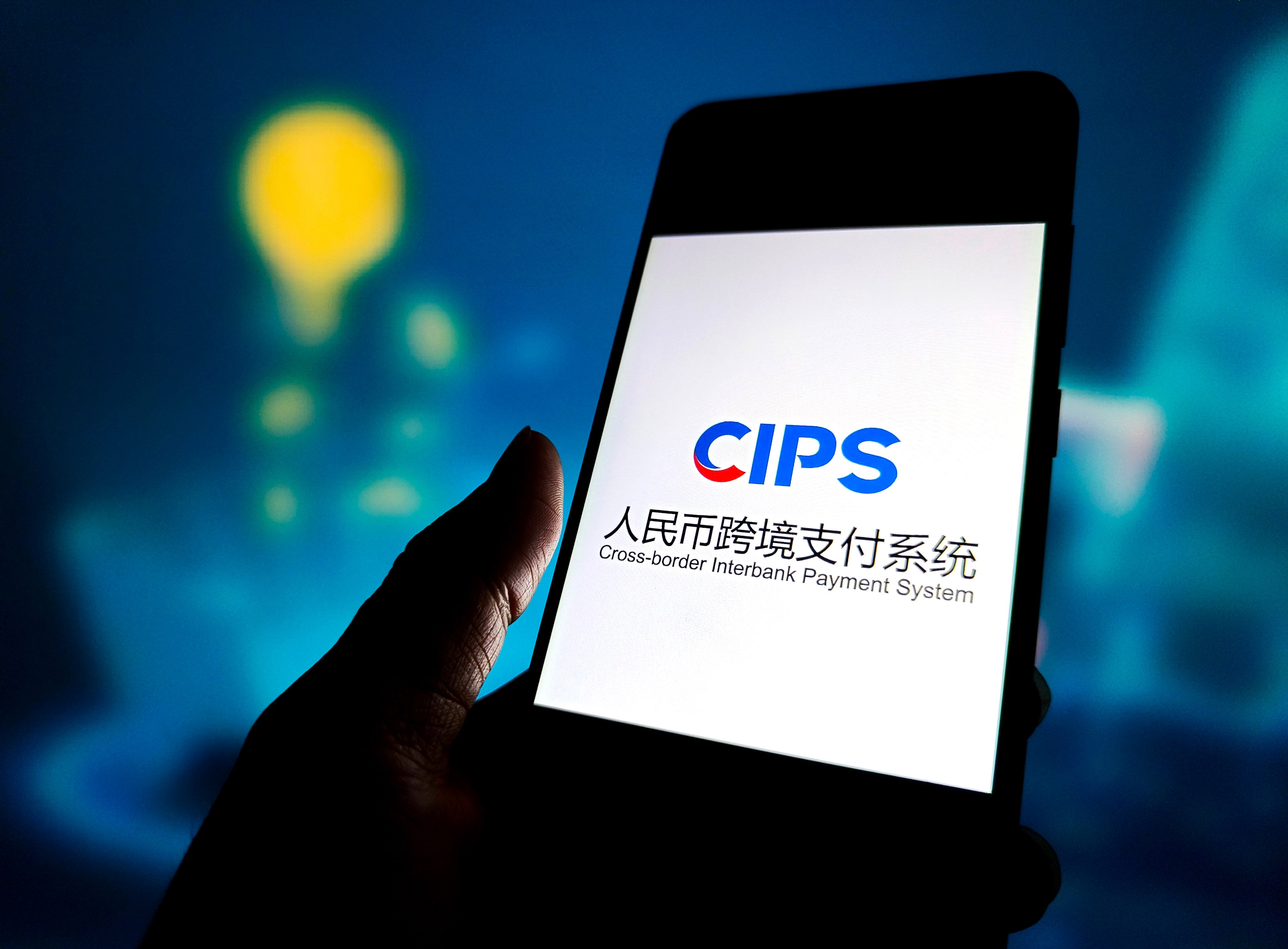 A CIPS logo is displayed on a smartphone. Photo: CFOTO/Future Publishing via Getty Images