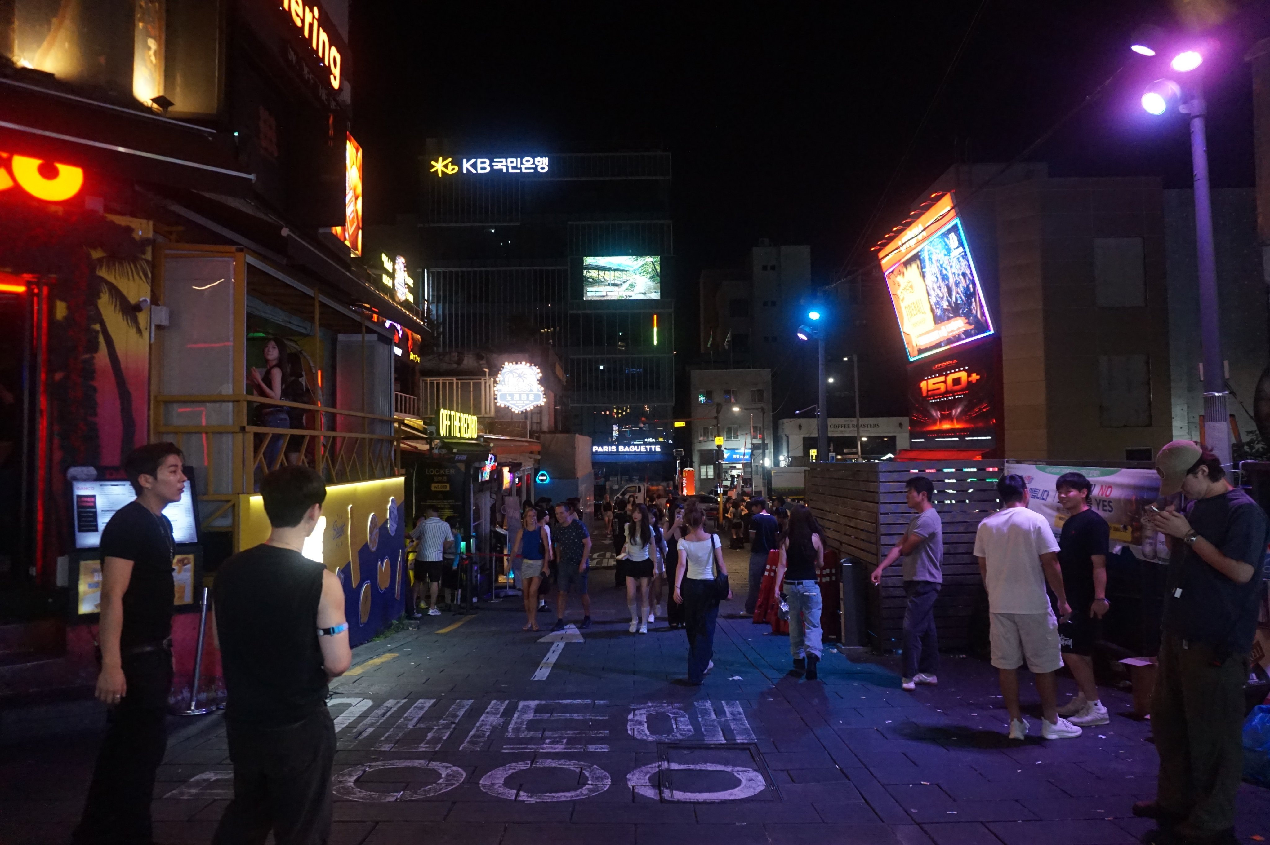Workers at the clubbing district of Itaewon in Seoul seek to draw customers to their clubs and bars. Photo: David D. Lee