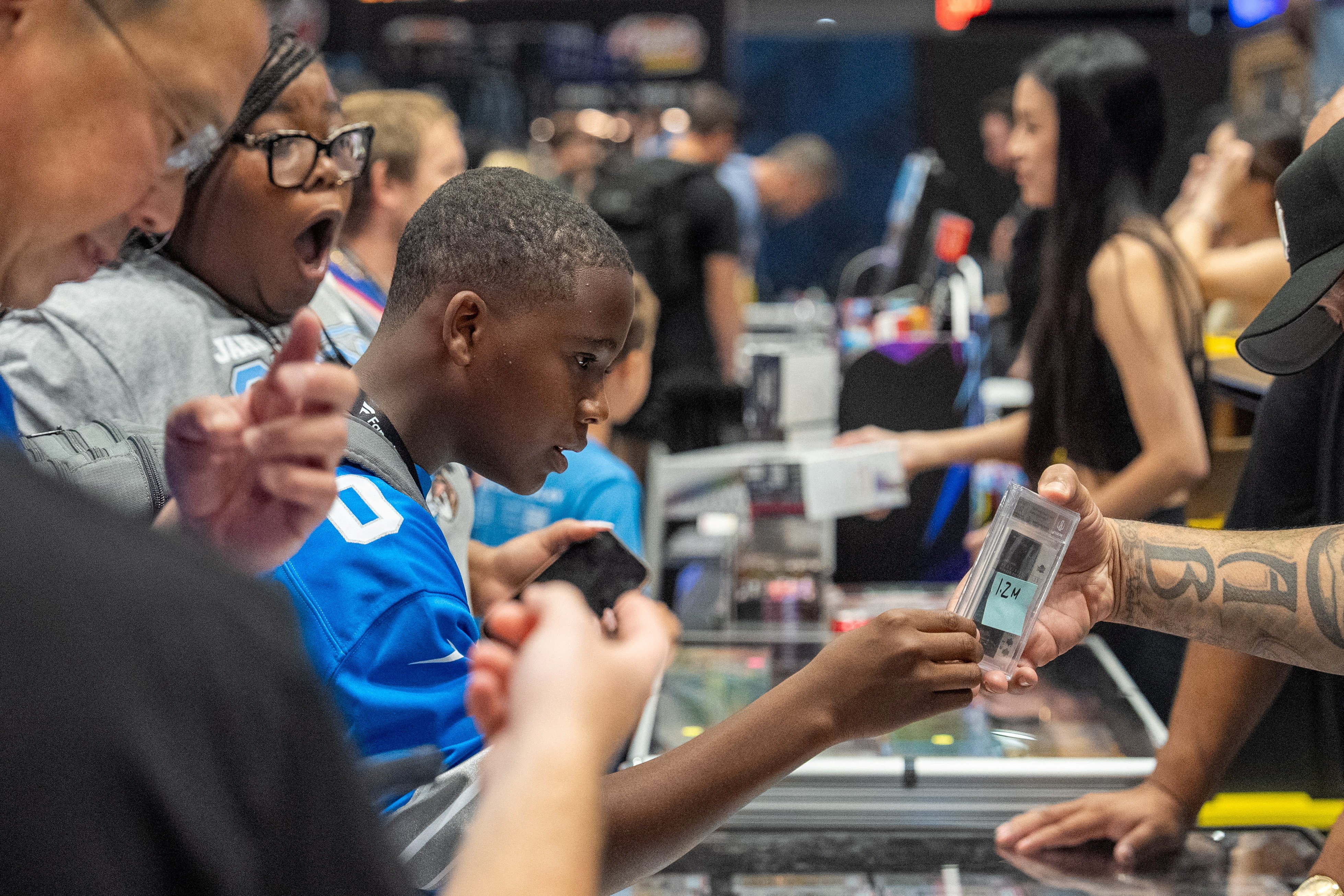 A fan looks at a trading card worth US$1.2 million at Fanatics Fest NYC in New York on July 16. Photo: Reuters