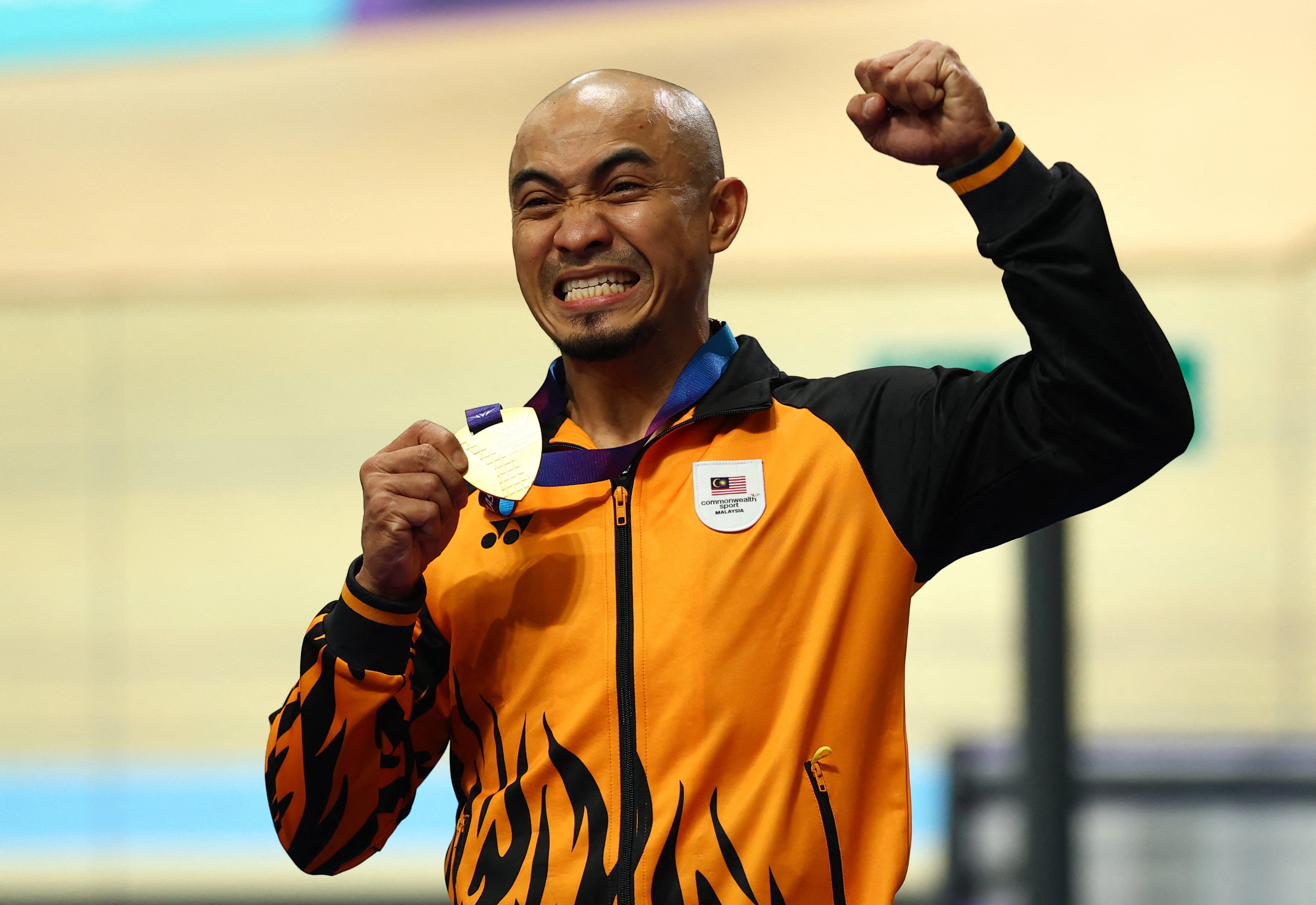 Malaysia’s Azizulhasni Awang celebrates winning Commonwealth Games gold at the Sir Chris Hoy Velodrome. Photo: Reuters