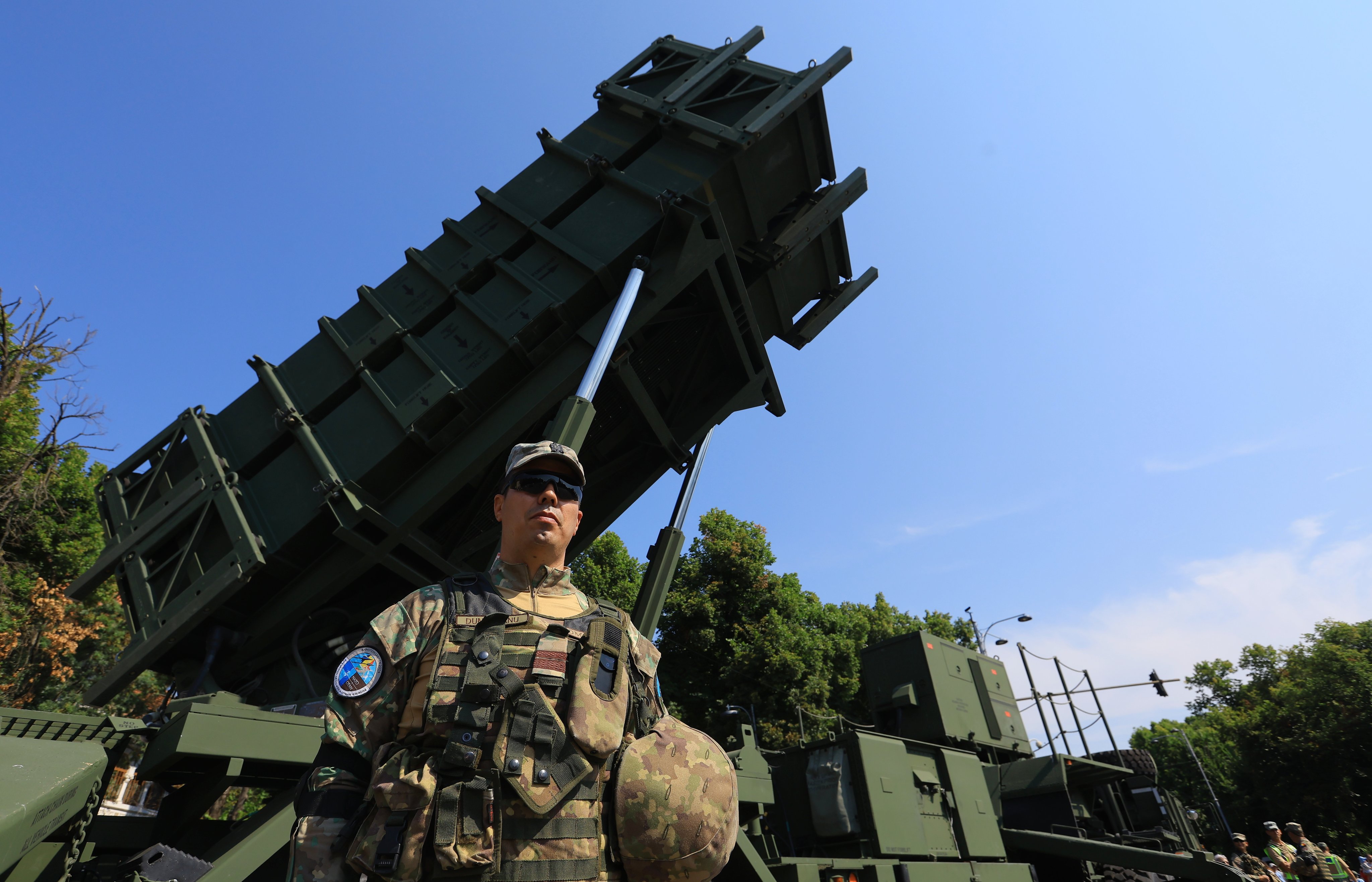 A Romanian soldier stands guard beside a Patriot surface-to-air missile system in Bucharest, Romania, on July 19. Photo: EPA