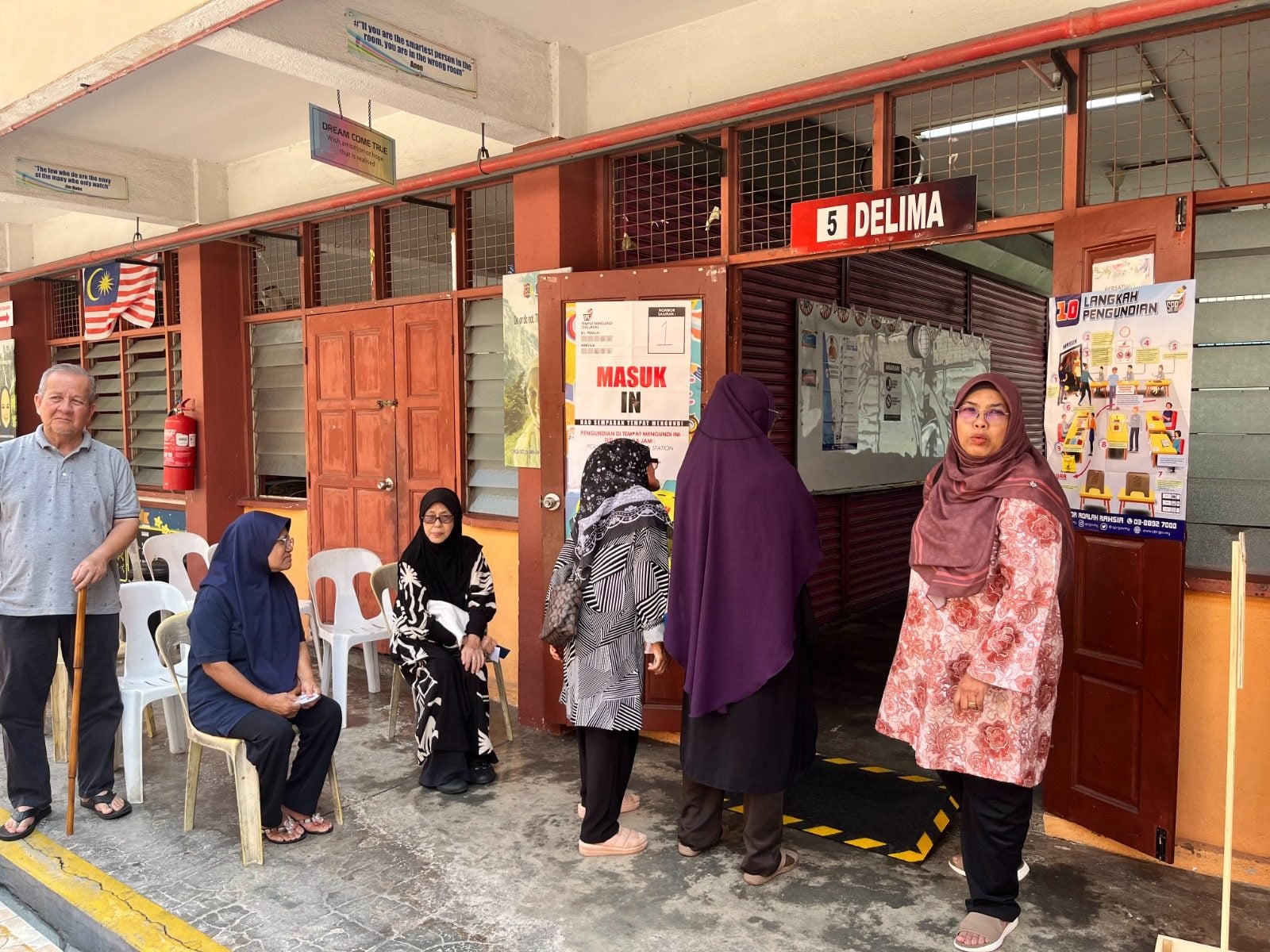 Voters in Ampangan, Seremban, queue up early to cast their vote on Saturday. Photo: Ushar Daniele