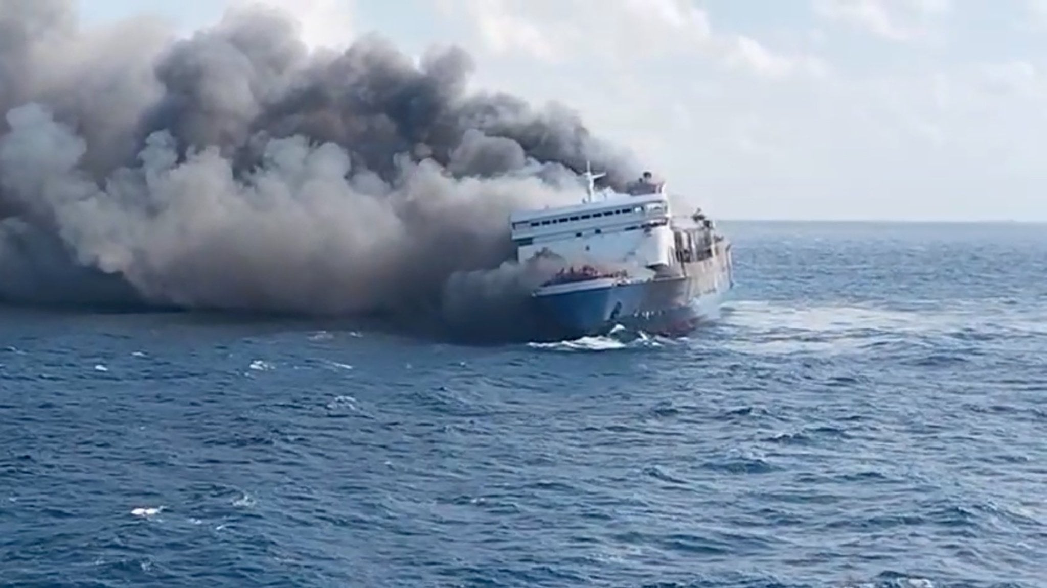 A still image taken from a handout video made available by Indonesia’s National Search and Rescue Agency shows thick smoke billowing from a passenger ferry on Sunday. Photo: via EPA