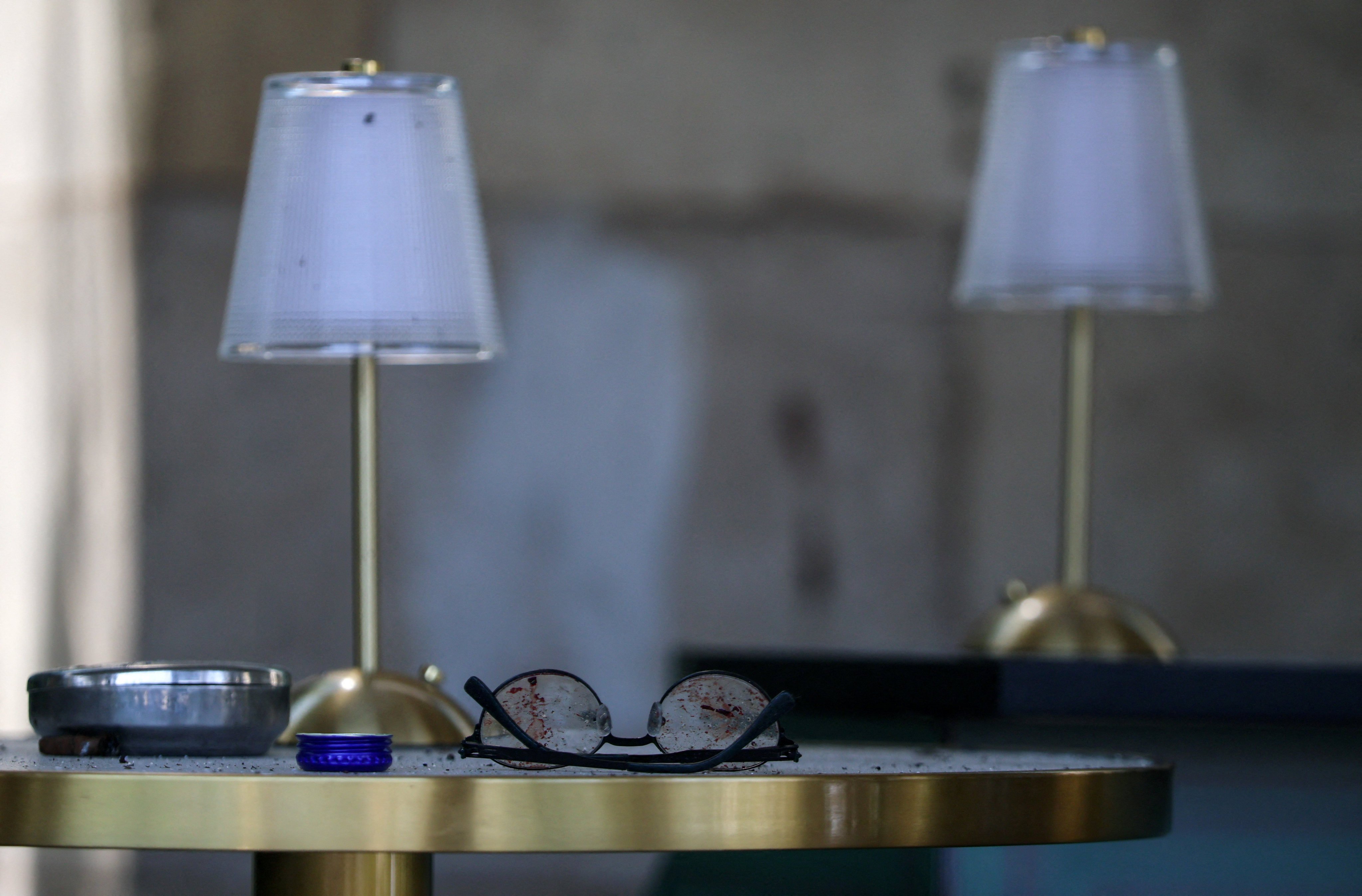 Broken glasses lie on a table inside Moscow’s fenced-off Balzi Rossi Italian restaurant on Sunday following Saturday’s deadly bomb explosion. Photo: Reuters