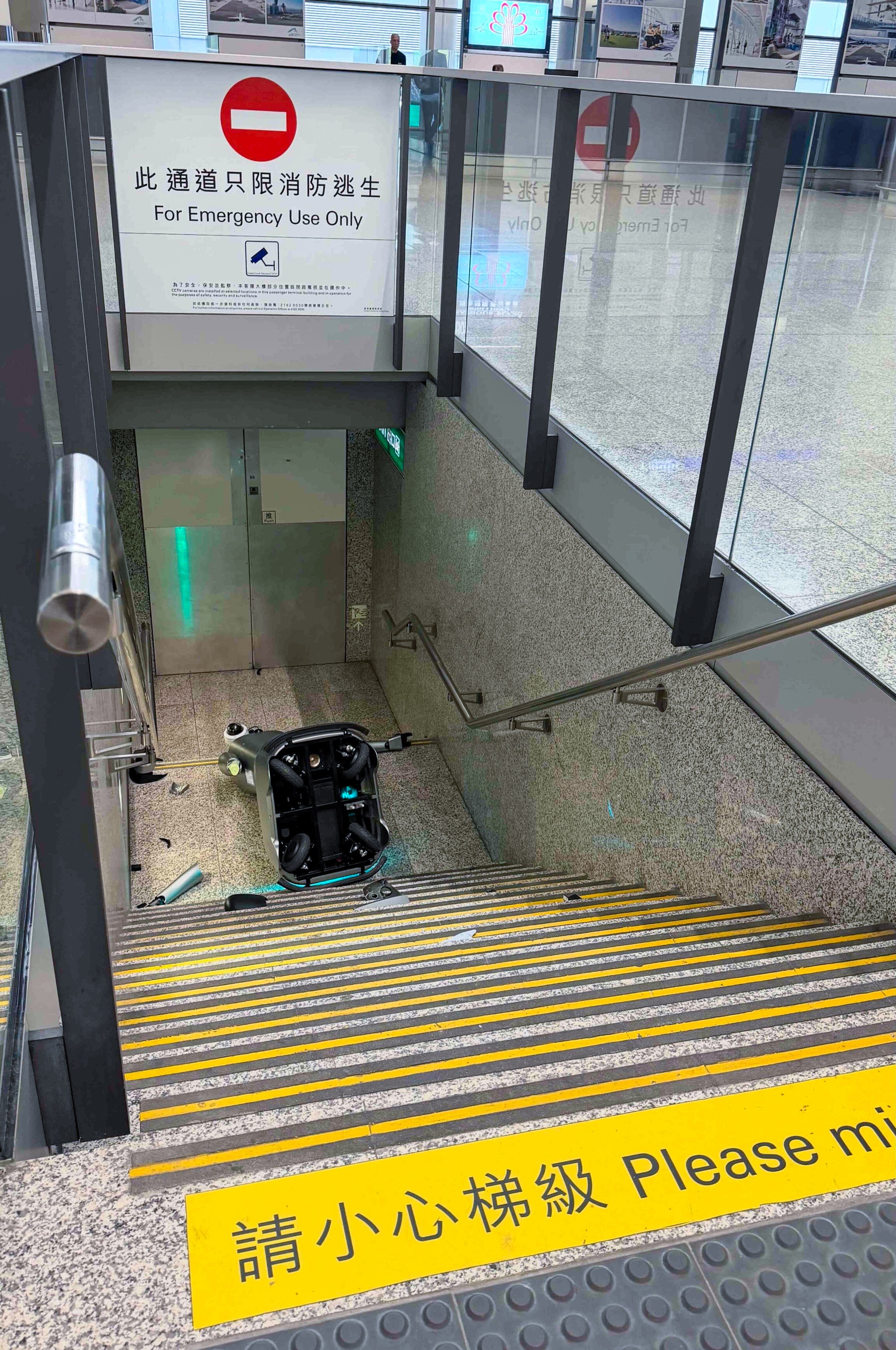 The robot lies at the bottom of the staircase with its arms shattered into pieces. Photo: Handout