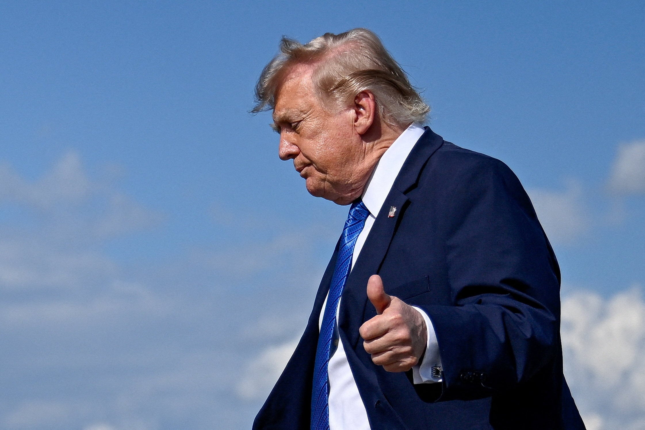 US President Donald Trump gives a thumbs-up as he walks to board Marine One following his arrival at Morristown Municipal Airport on Friday. Photo: Reuters
