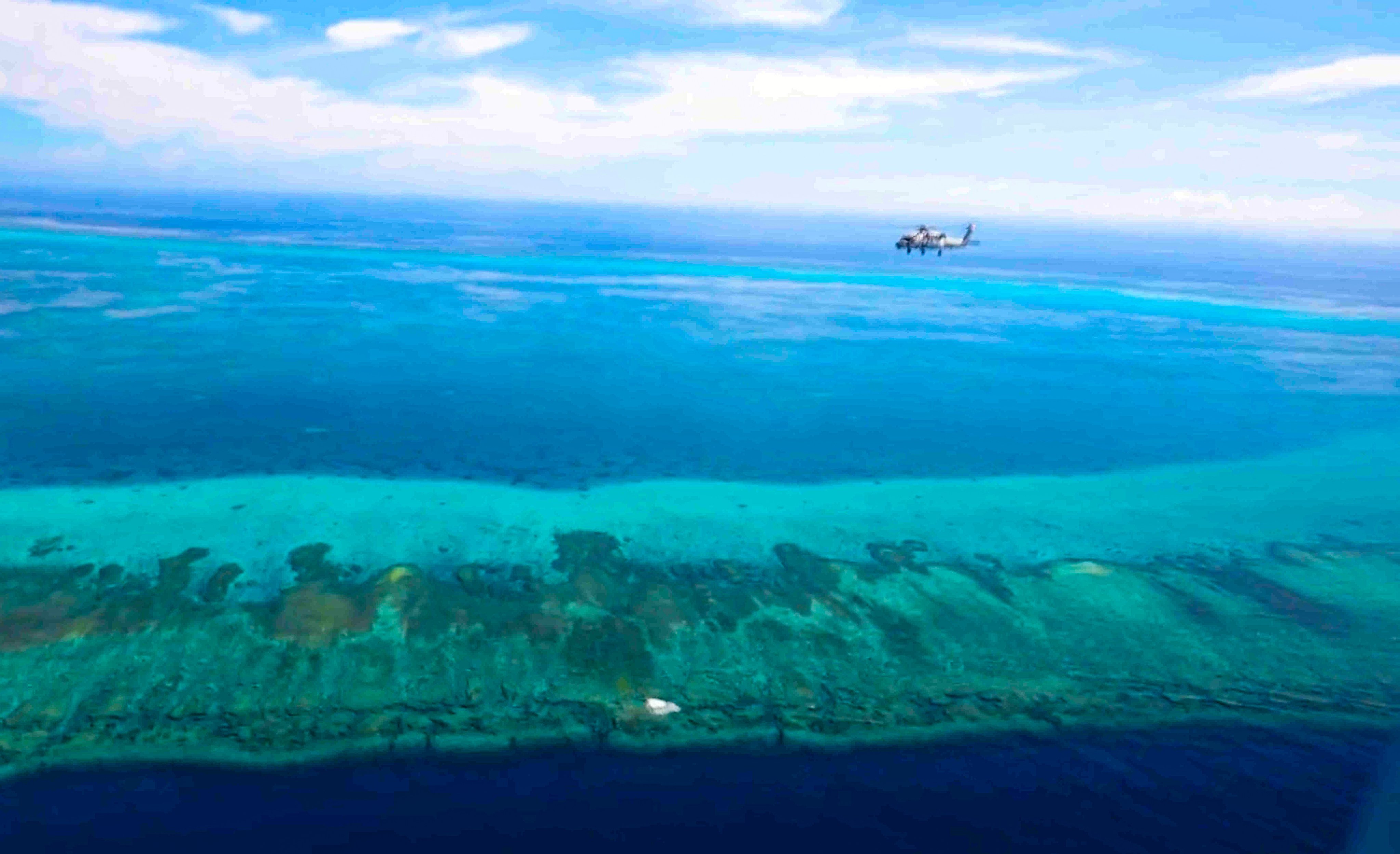 The PLA carries out joint naval and air drills around Scarborough Shoal on August 1, days after the Philippines filed its official ​nautical chart for the disputed South China Sea feature with the United Nations. Photo: Handout