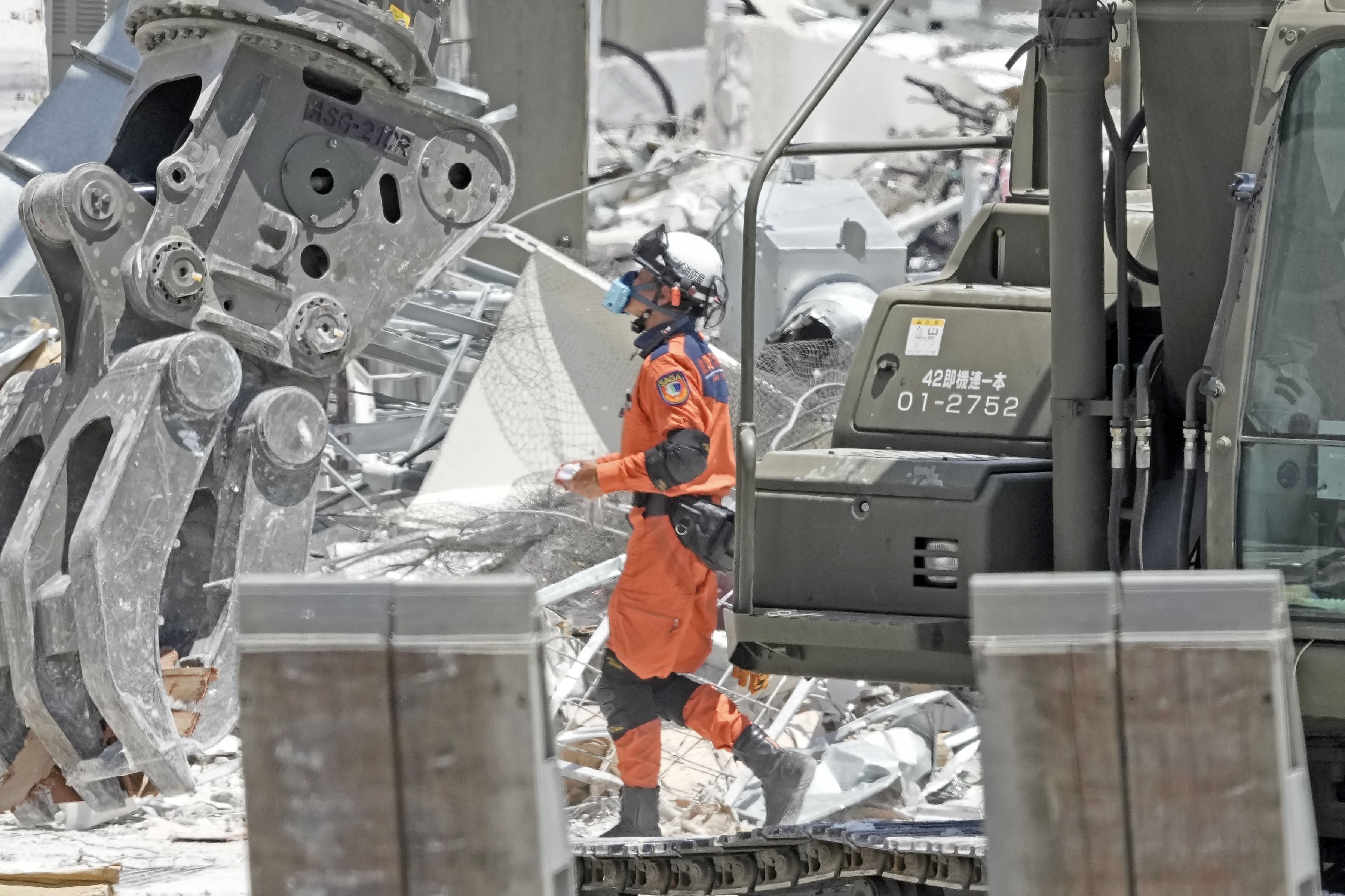 A firefighter engages in a search and rescue operation at Aeon Mall Kumamoto on Friday. Photo: Kyodo