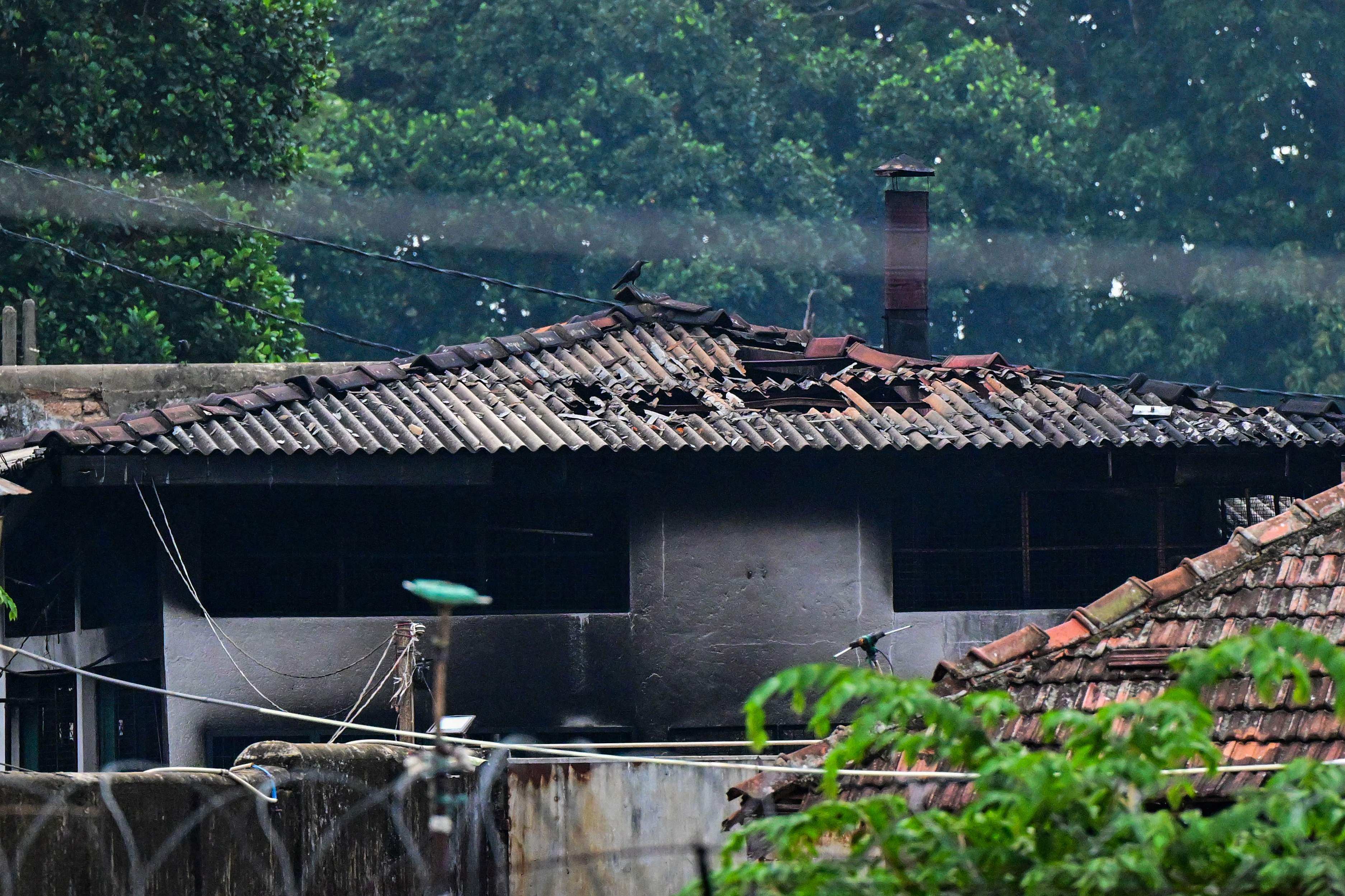A damaged building is seen on Sunday, a day after a riot at the Mahara Prison complex. Photo: AFP