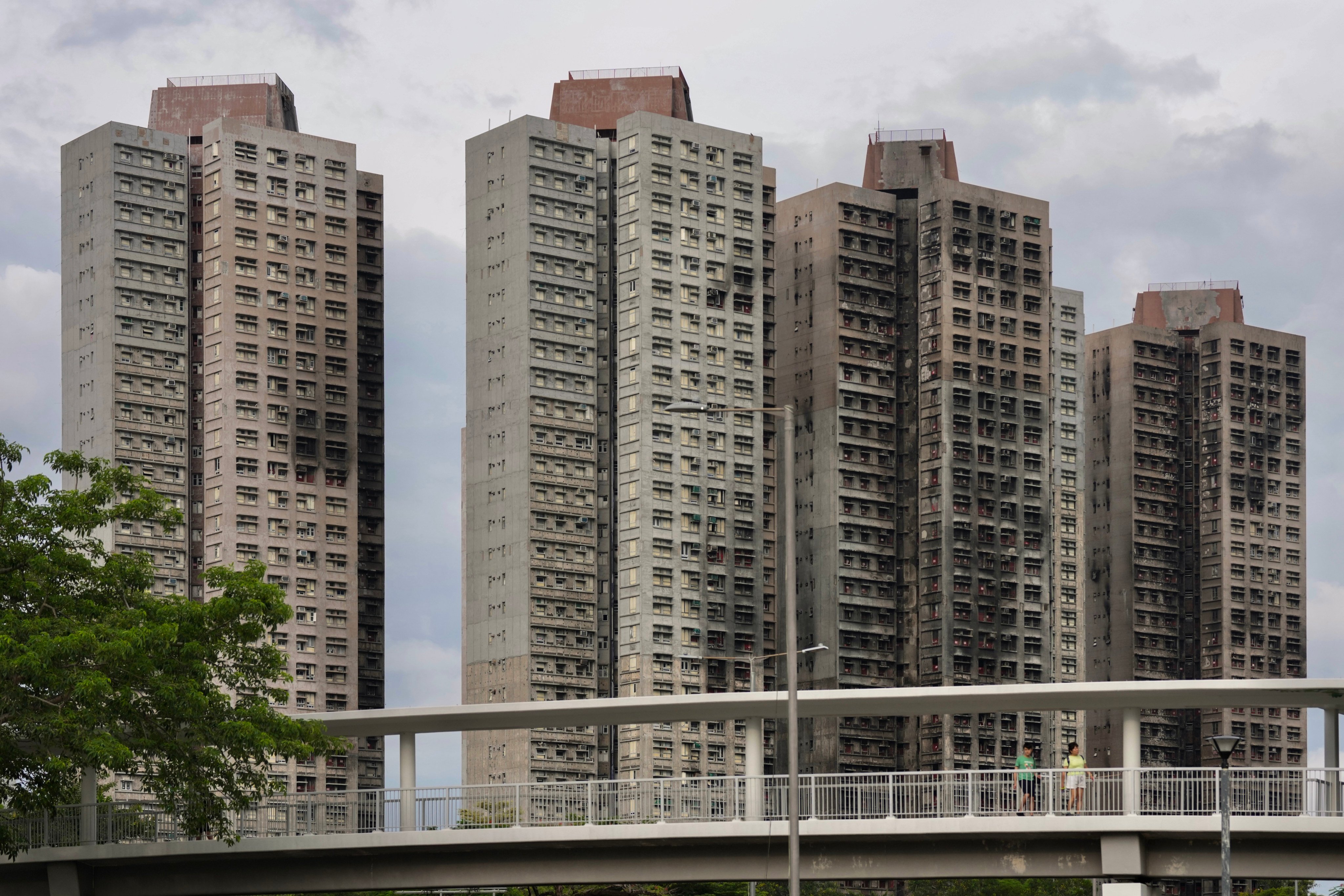 The catastrophic fire at Wang Fuk Court last November killed 168 people and displaced nearly 5,000 others. Karma Lo