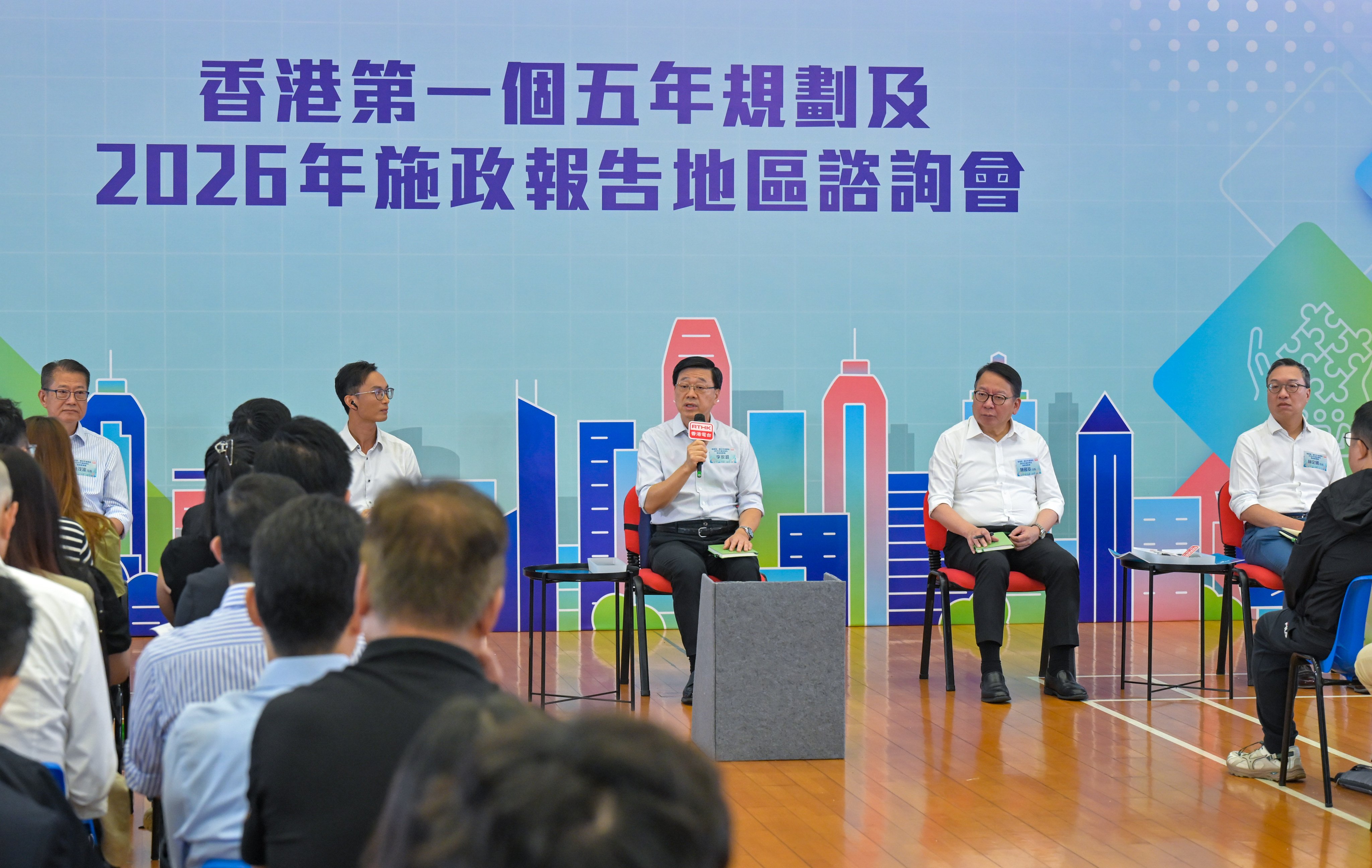 Chief Executive John Lee, flanked by the city’s ministers, takes questions and comments from residents at the town hall on Sunday. Photo: Handout
