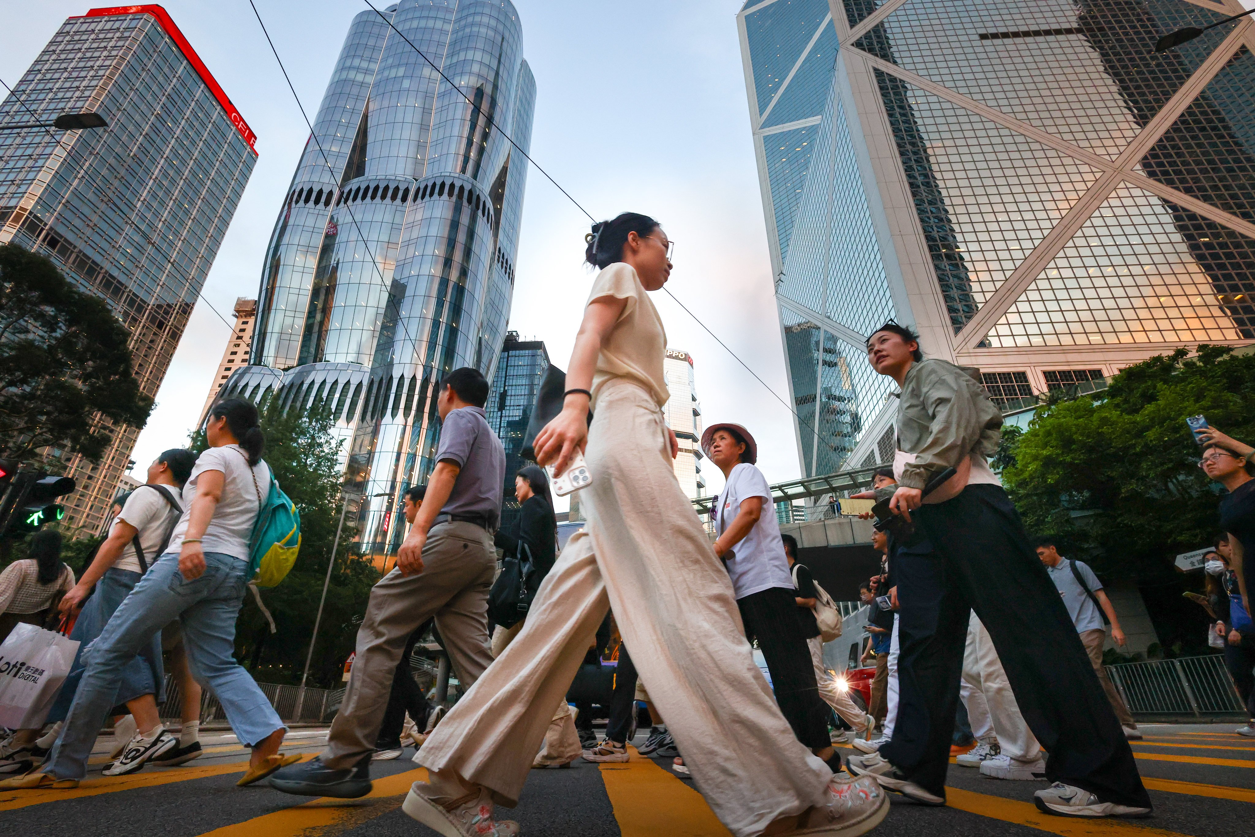 Pedestrians in Hong Kong’s central business district. Chan has said authorities will revise the city’s annual GDP forecast later this month. Photo: Dickson Lee