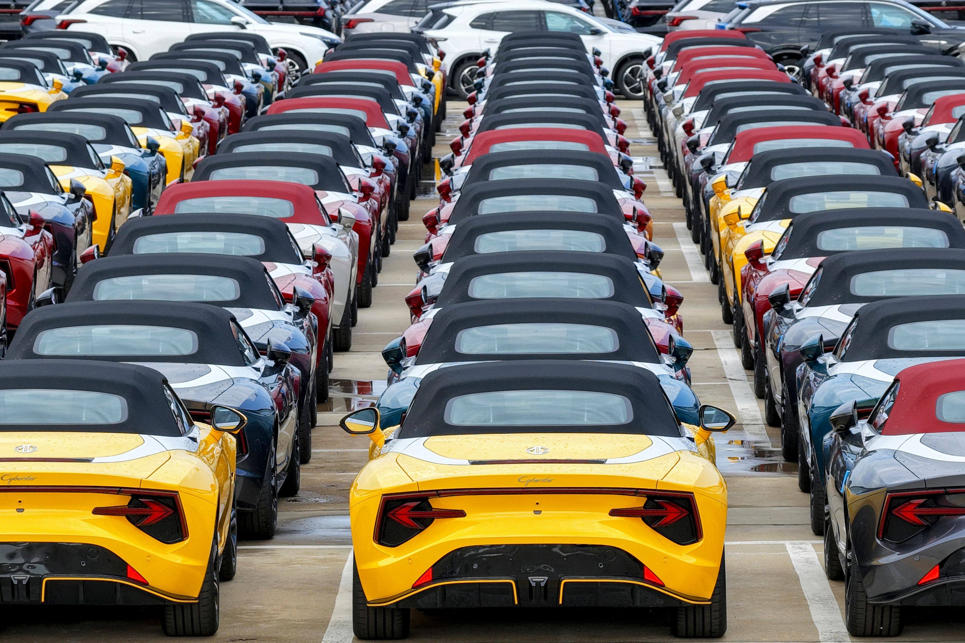 Chinese-made MG Cyberster electric vehicles await loading onto a ship for export. Photo: AFP