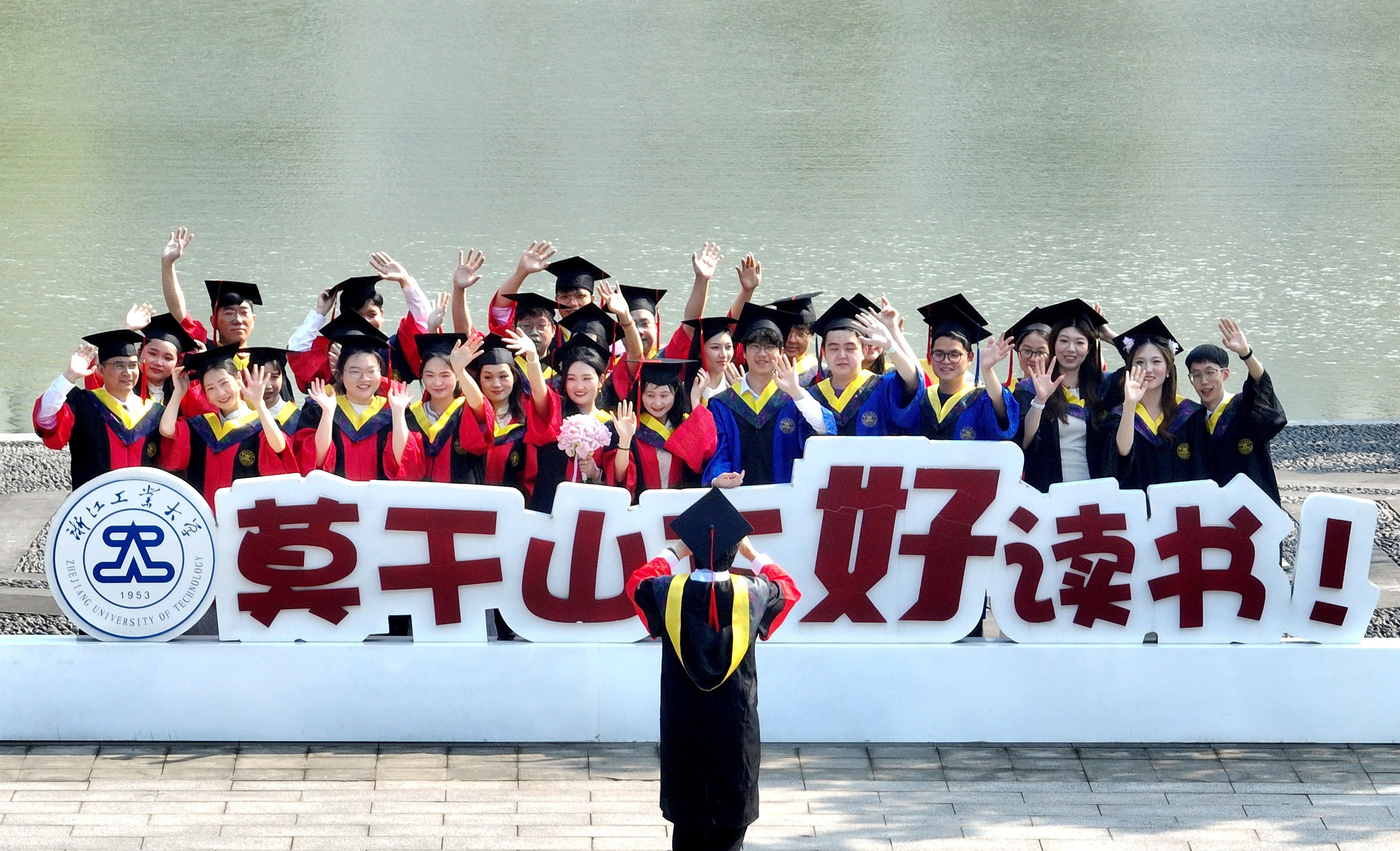 Students pose for graduation photos on the campus of Zhejiang University of Technology, June 2, 2026. Photo: VCG via Getty Images