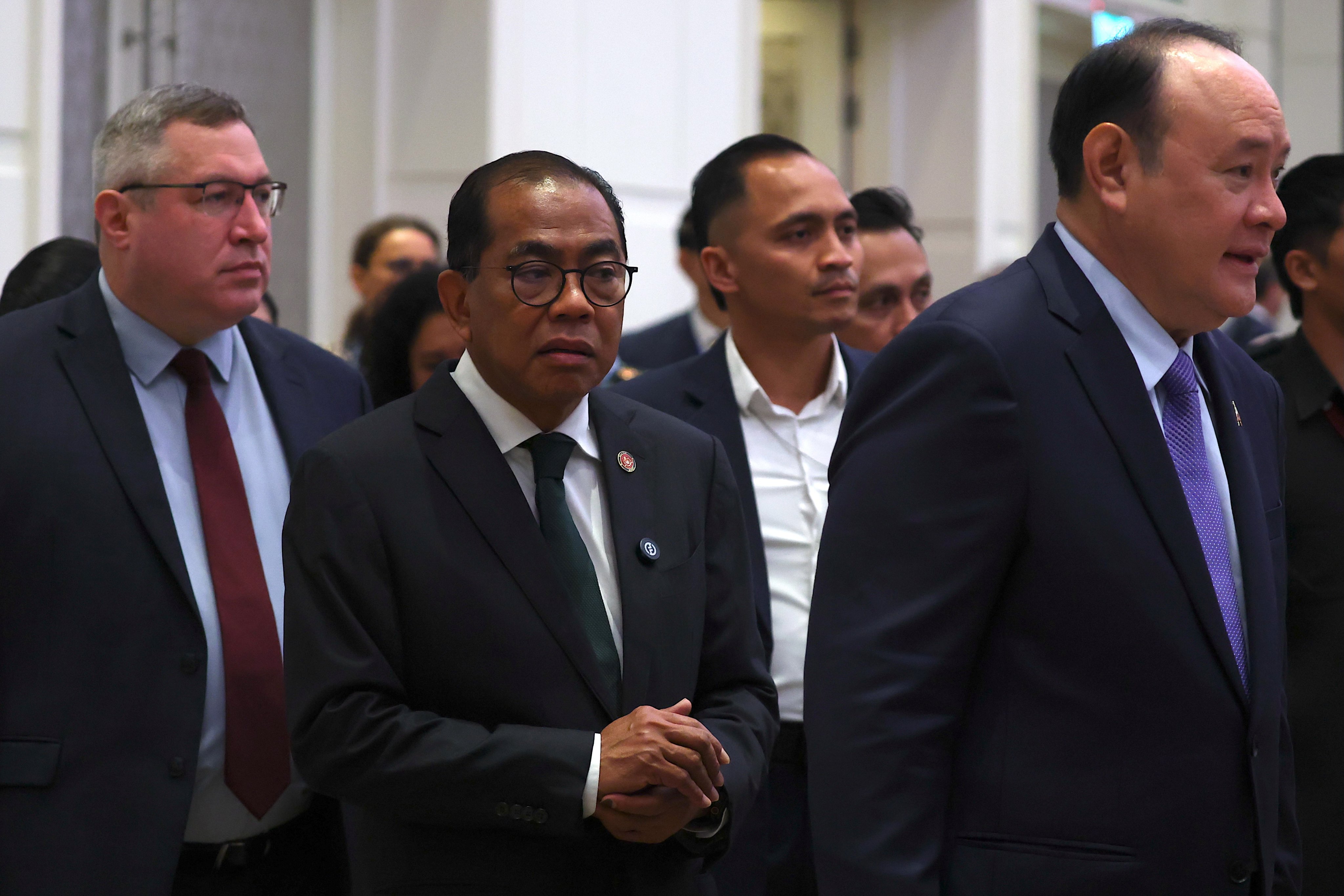Malaysia’s Defence Minister Khaled Nordin (centre) and his Philippine counterpart Gilberto Teodoro Jnr (right) arrive at the 37th International Military Law and Operations Conference in Kuala Lumpur, Malaysia, on Monday. Photo: EPA