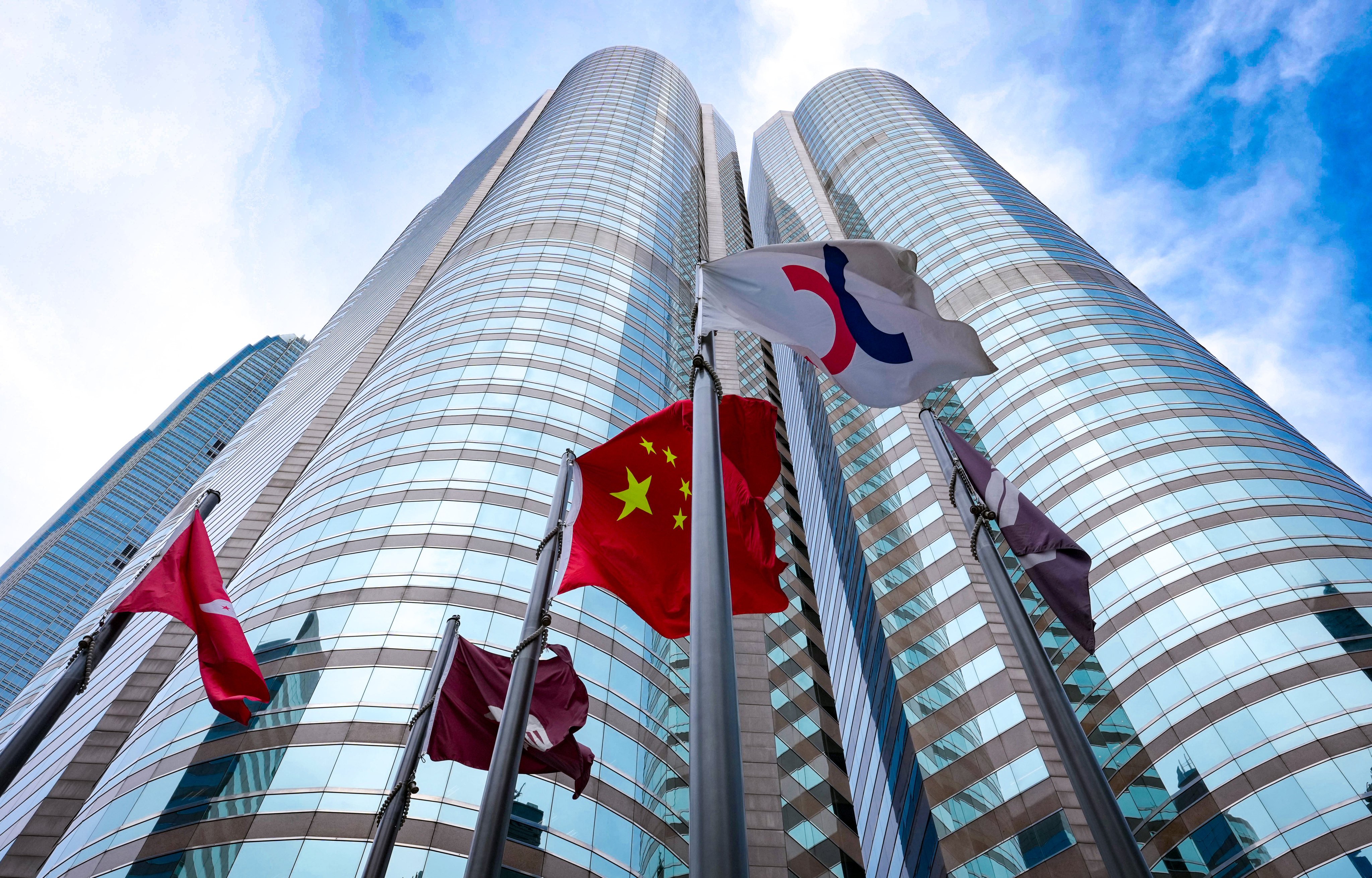 Flags, including the Hong Kong Special Administrative Region and Chinese national flags, at Exchange Square in Central, Hong Kong, where the city’s stock exchange is located. Jelly Tse