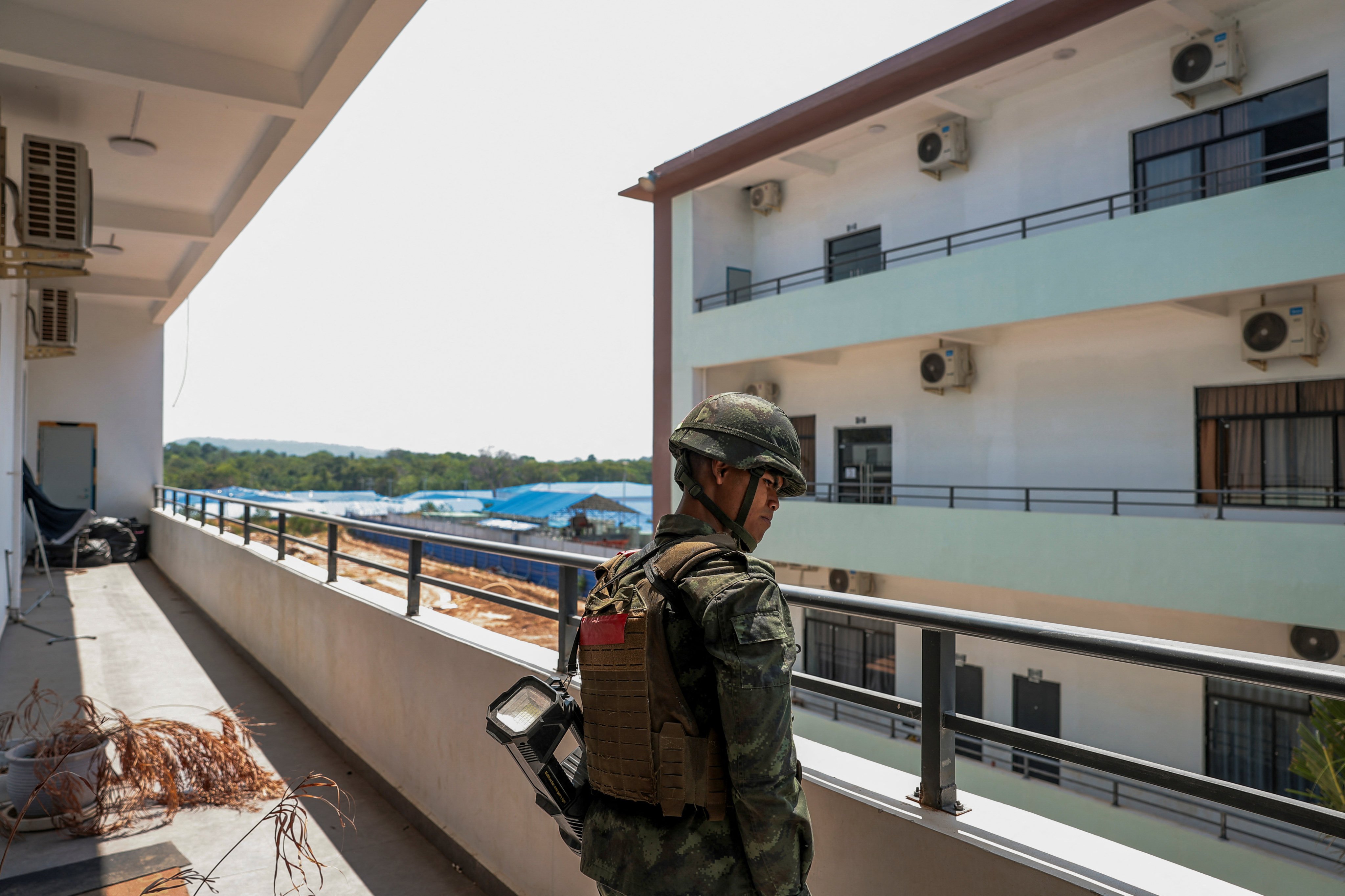 A Thai soldier stands guard in a compound that the Thai military says was used for scam operations, in the town of O’Smach, along Cambodia’s northern border with Thailand, on April 7. Photo: Reuters